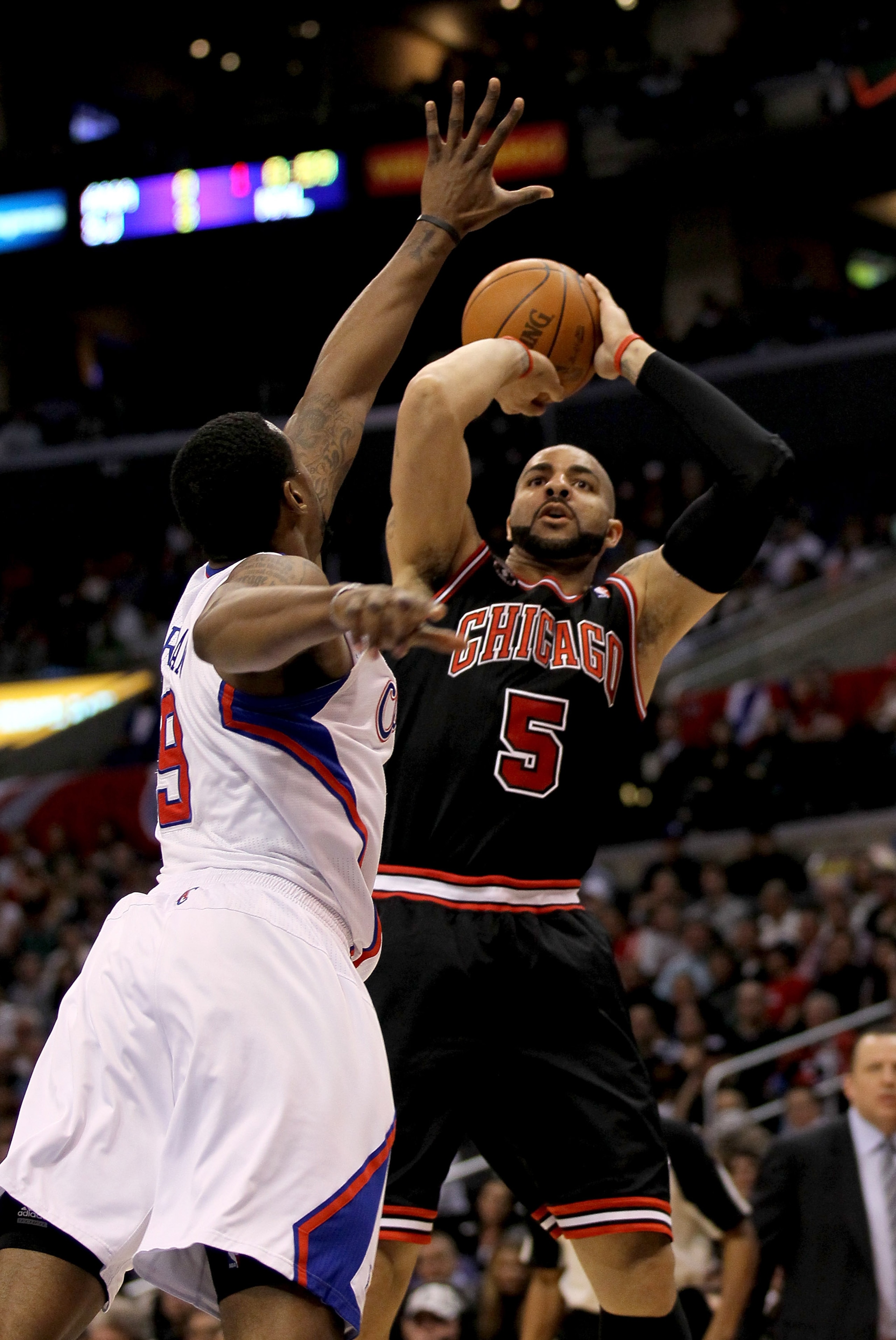 LOS ANGELES, CA - FEBRUARY 2:  Carlos Boozer #5 of the Chicago Bulls shoots over DeAndre Jordan #5 of the Los Angeles Clippers at Staples Center on February 2, 2011  in Los Angeles, California. The Bulls won 106-88.  NOTE TO USER: User expressly acknowled