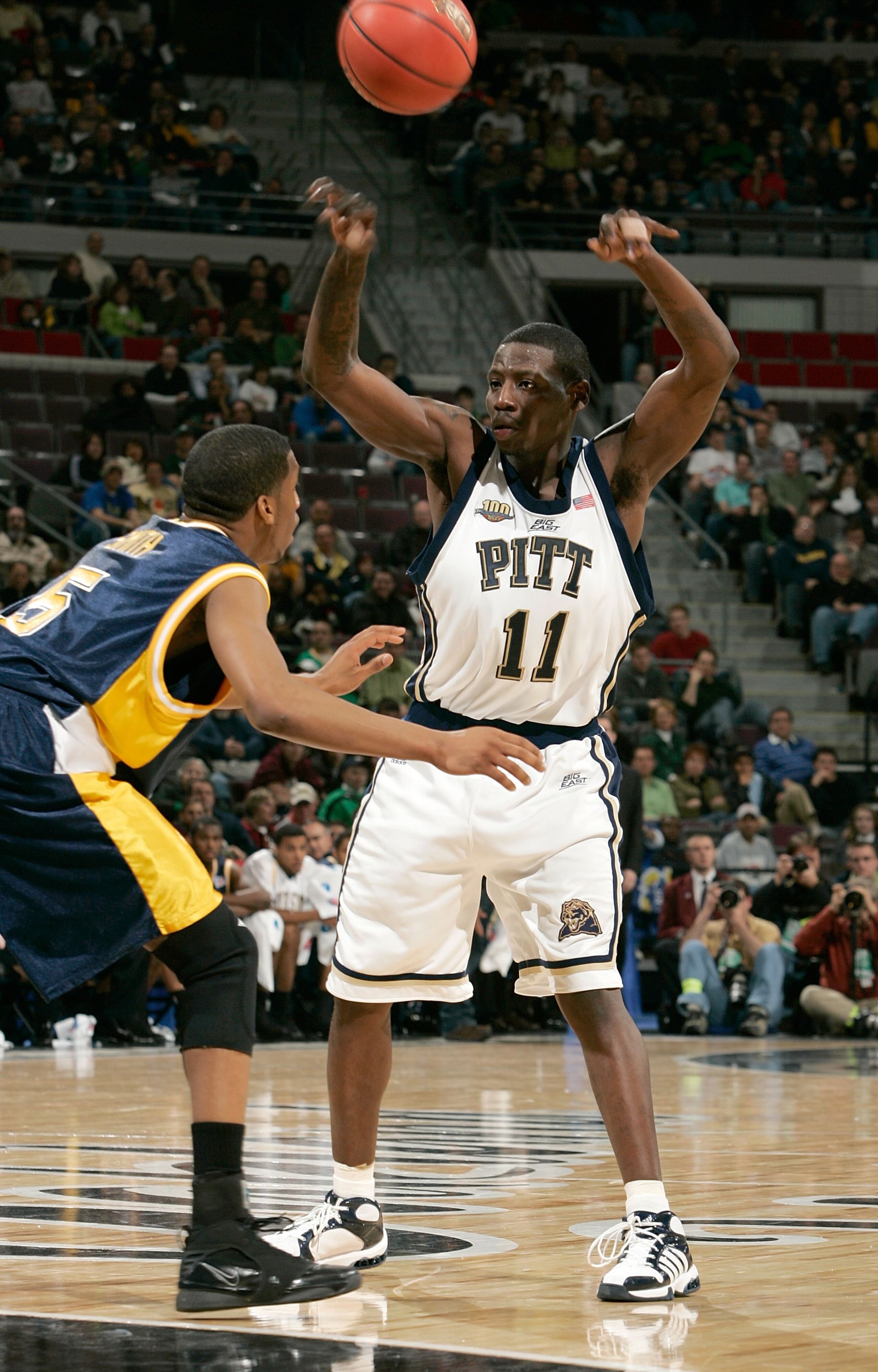 AUBURN HILLS, MI - MARCH 17: Carl Krauser #11 of the Pittsburgh Panthers passes against the defense of the Kent State Flashes during the First Round of the 2006 NCAA Men's Basketball Tournament at The Palace of Auburn Hills on March 17, 2006 in Auburn Hil