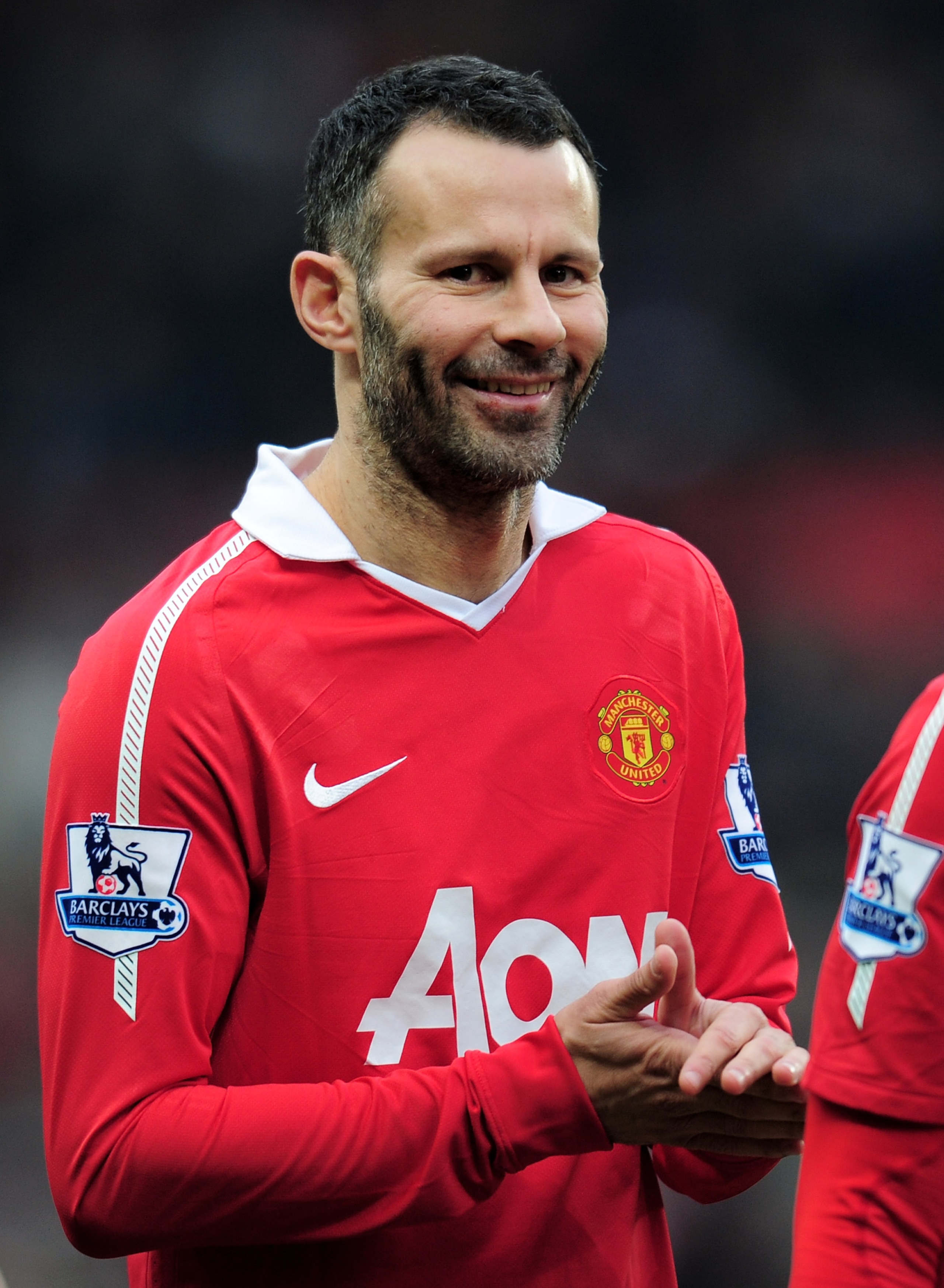 MANCHESTER, ENGLAND - JANUARY 22:  Ryan Giggs of Manchester United smiles prior to the Barclays Premier League match between Manchester United and Birmingham City at Old Trafford on January 22, 2011 in Manchester, England.  (Photo by Shaun Botterill/Getty