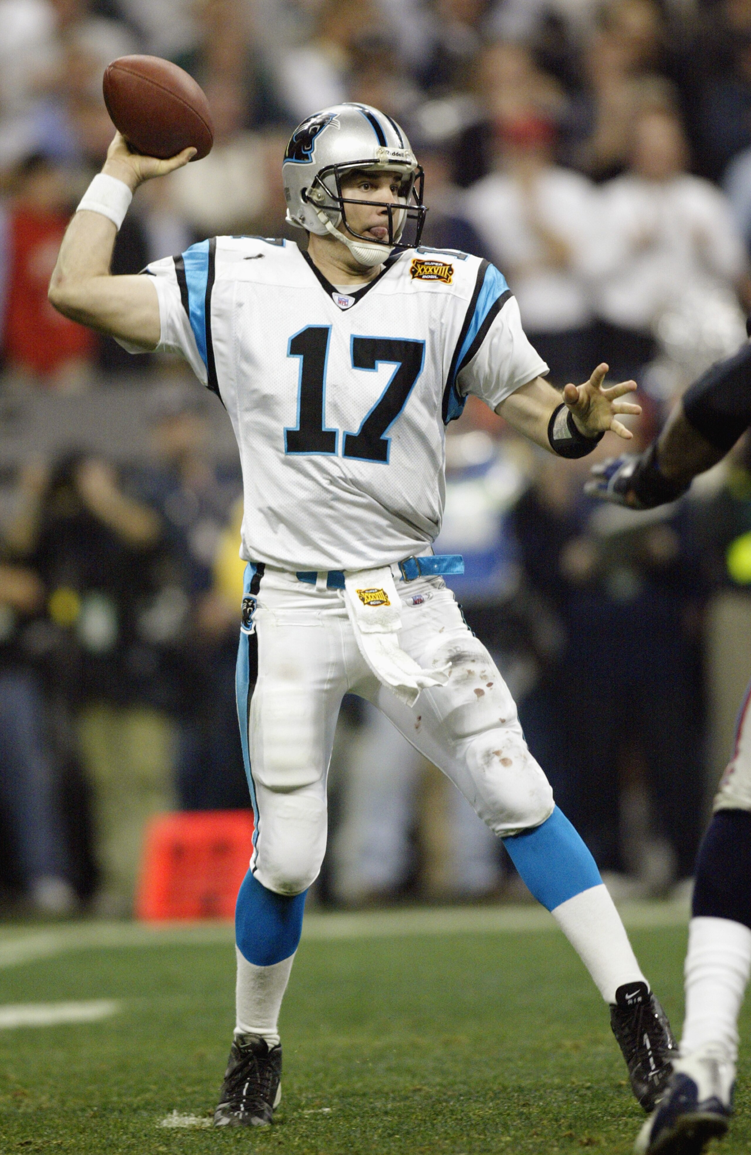 HOUSTON, TX - FEBRUARY 1:  Quarterback Jake Delhomme #17 of the Carolina Panthers throws the ball against the New England Patriots during Super Bowl XXXVIII at Reliant Stadium on February 1, 2004 in Houston, Texas. The Patriots won 32-29 to claim their se