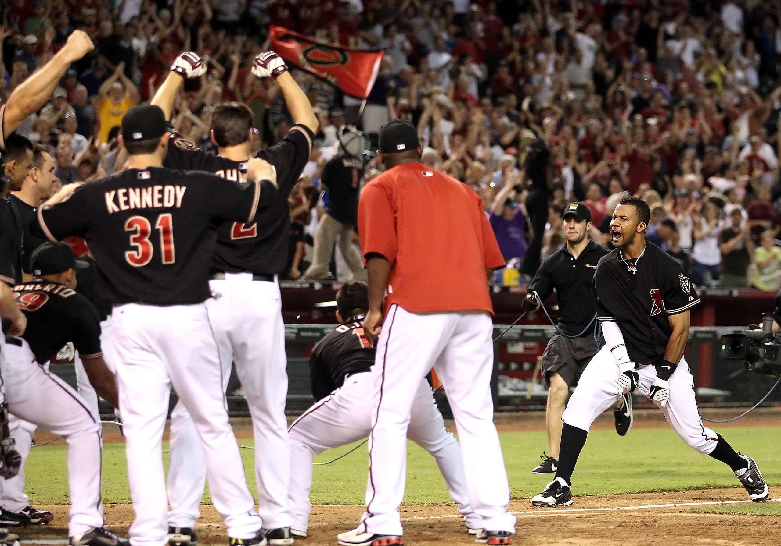 PHOENIX - AUGUST 07:  Chris Young #24 of the Arizona Diamondbacks celebrates with teammates after hitting a walk off solo home run against the San Diego Padres in the ninth inning of the Major League Baseball game at Chase Field on August 7, 2010 in Phoen