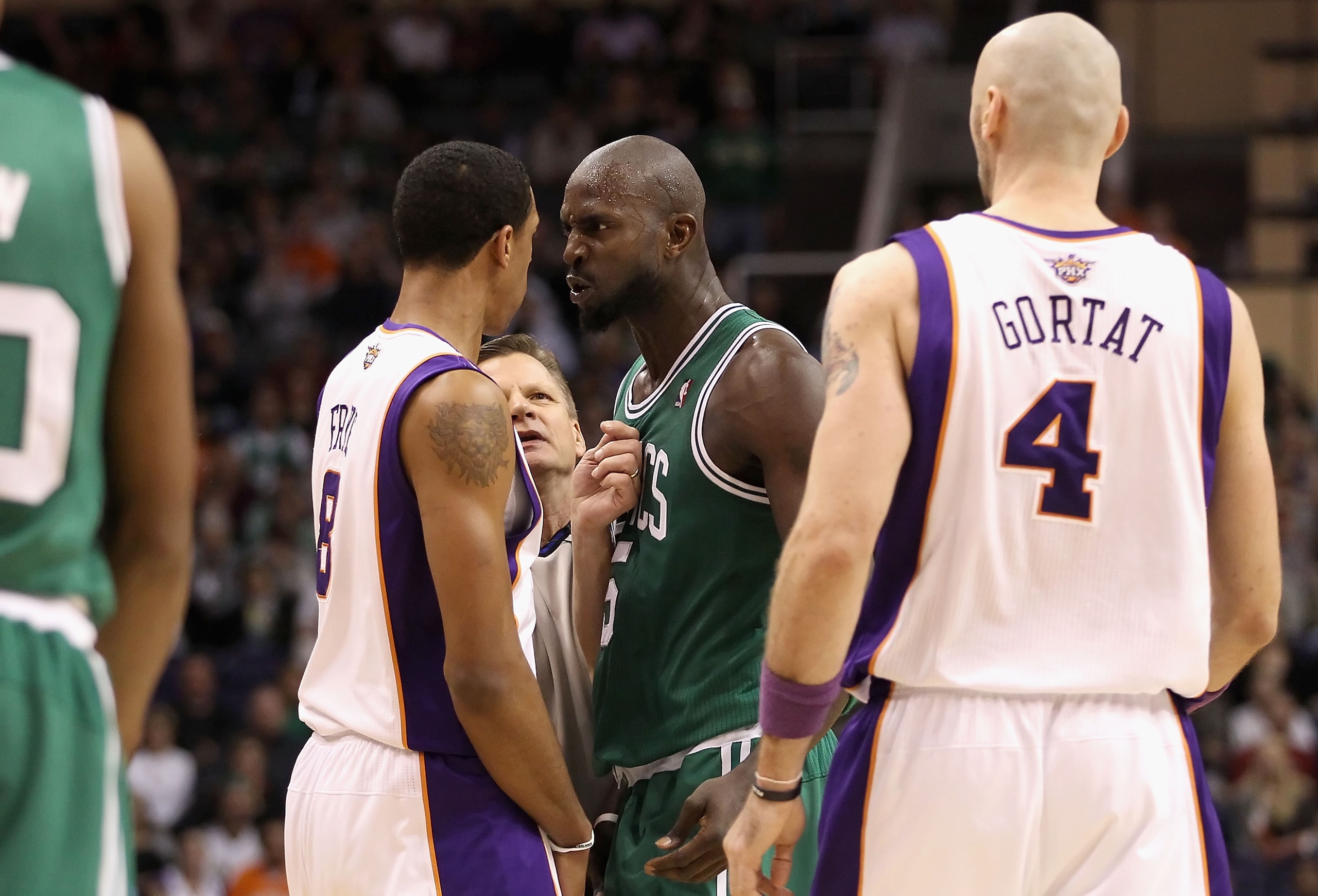 PHOENIX, AZ - JANUARY 28:  Kevin Garnett #5 of the Boston Celtics stares down Channing Frye #8 of the Phoenix Suns after Garnett was called for a technical foul during the NBA game at US Airways Center on January 28, 2011 in Phoenix, Arizona.  The Suns de