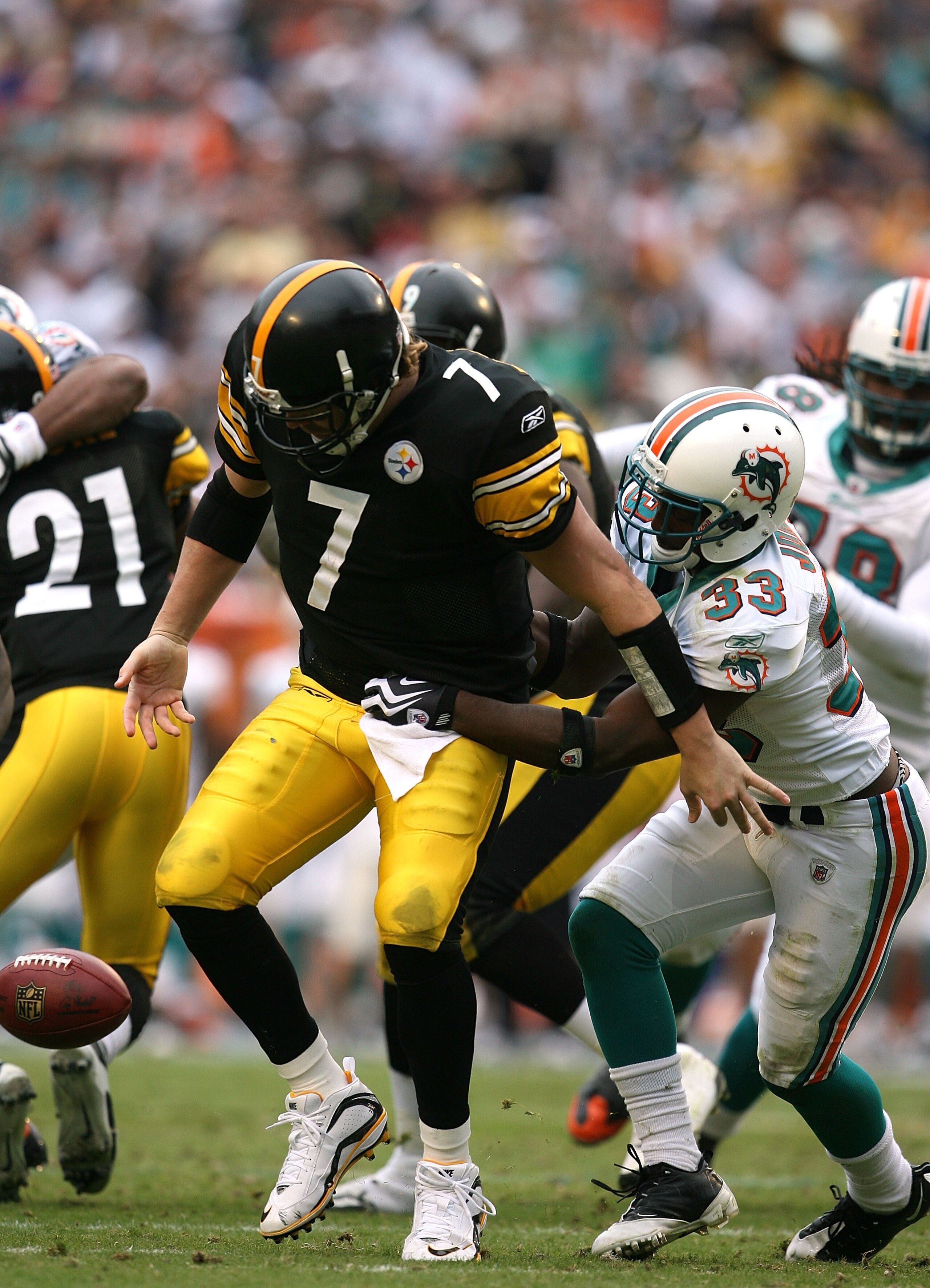 MIAMI - JANUARY 03:  Quarterback Ben Roethlisberger #7 of the Pittsburgh Steelers fumbles as he is sacked by cornerback Nathan Jones #33 of the Miami Dolphins at Land Shark Stadium on January 3, 2010 in Miami, Florida. The Steelers defeated the Dolphins 3