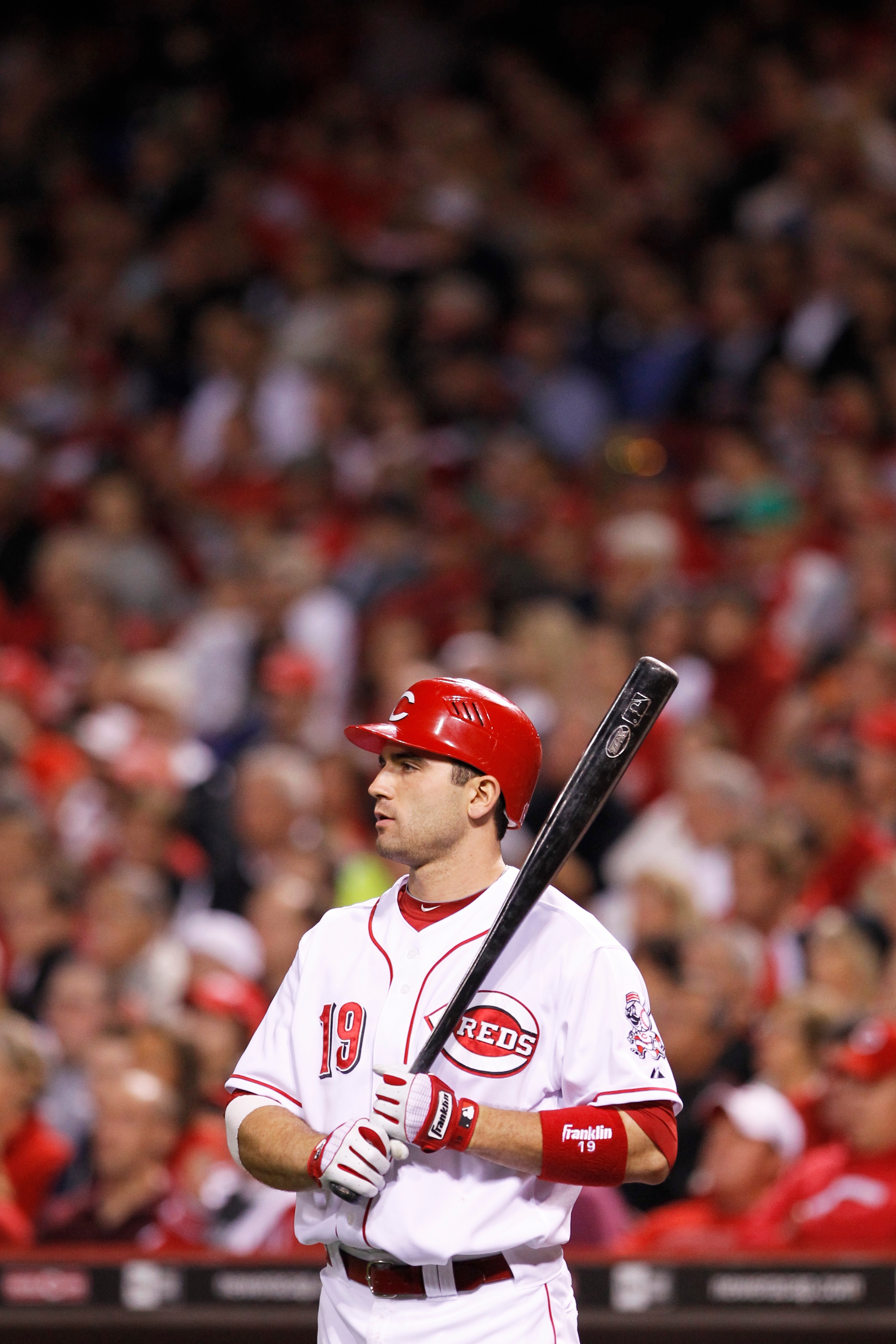 CINCINNATI, OH - SEPTEMBER 28: Joey Votto #19 of the Cincinnati Reds looks on while waiting to bat against the Houston Astros at Great American Ball Park on September 28, 2010 in Cincinnati, Ohio. The Reds won 3-2 to clinch the NL Central Division title.