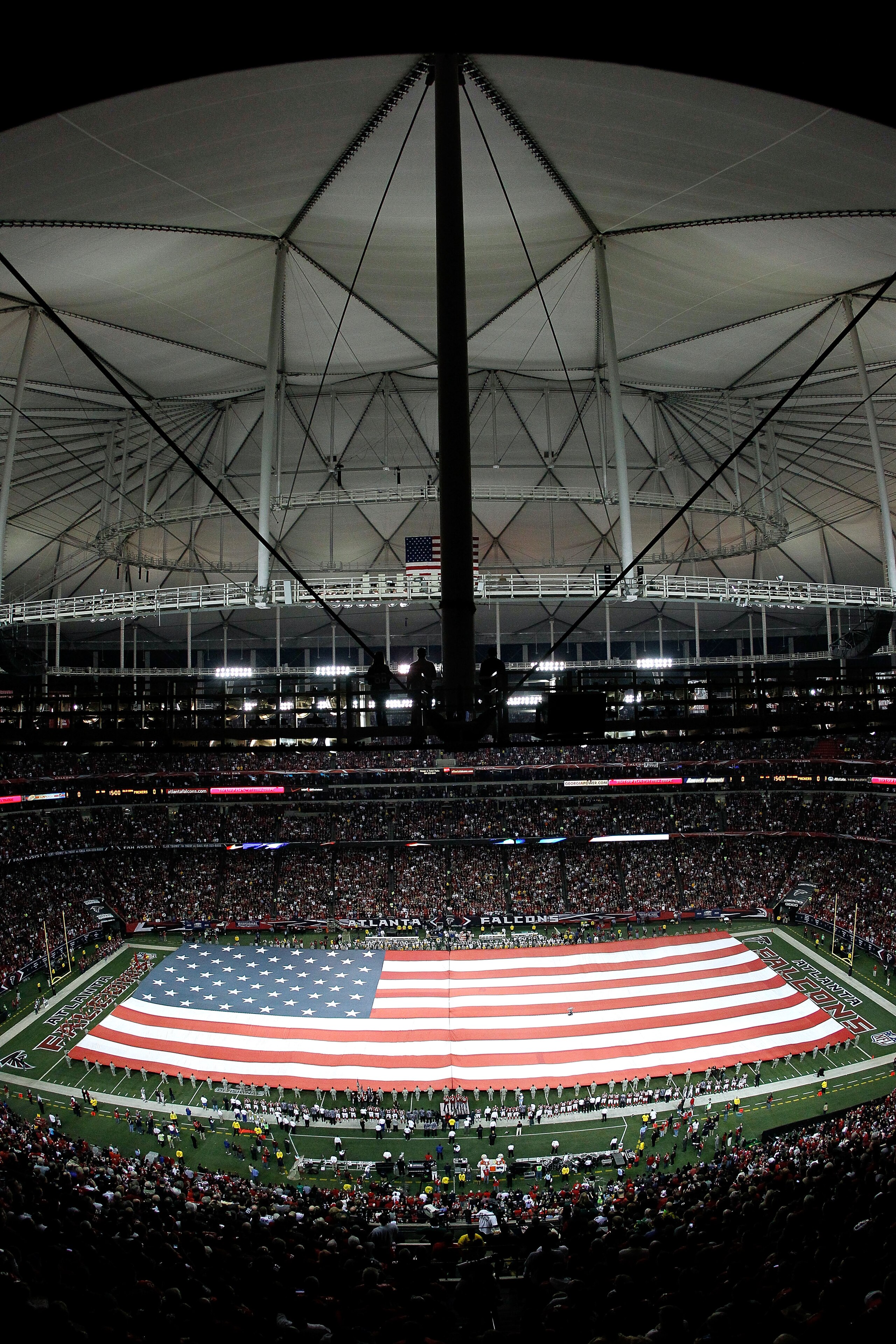 ATLANTA, GA - JANUARY 15:  A general view of a giant American Flag as it's stretched across the field for the performance of the National Anthem prior to the Atlanta Falcons playing against the Green Bay Packers during their 2011 NFC divisional playoff ga