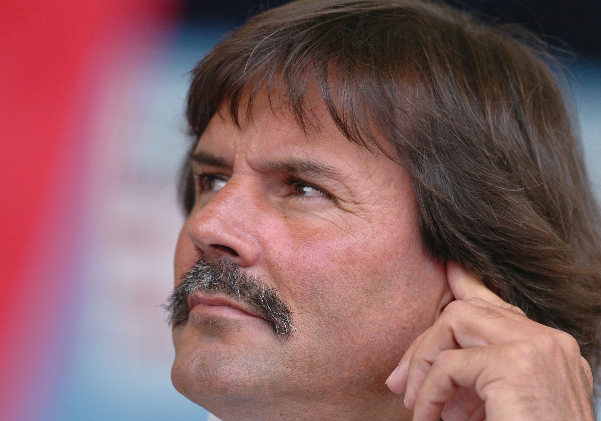 Pitcher Dennis Eckersley listens to speeches  at  2004  Baseball Hall of Fame induction ceremonies  July 25, 2004 in Cooperstown, New York. (Photo by A. Messerschmidt/Getty Images) *** Local Caption ***