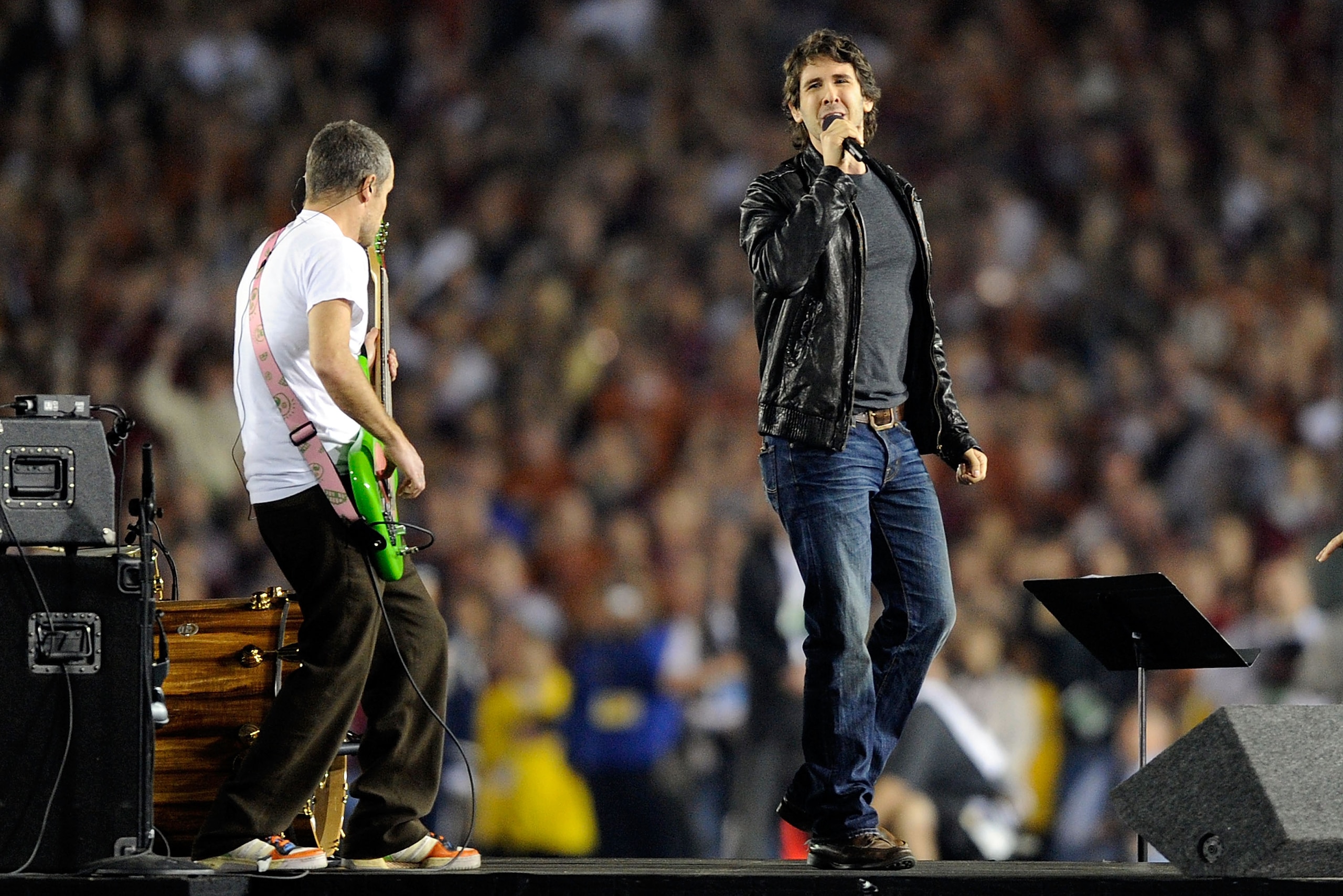 PASADENA, CA - JANUARY 07:  (L-R) Musician Flea and singer Josh Groban perform the national anthem prior to the Citi BCS National Championship game between the Texas Longhorns and the Alabama Crimson Tide at the Rose Bowl on January 7, 2010 in Pasadena, C