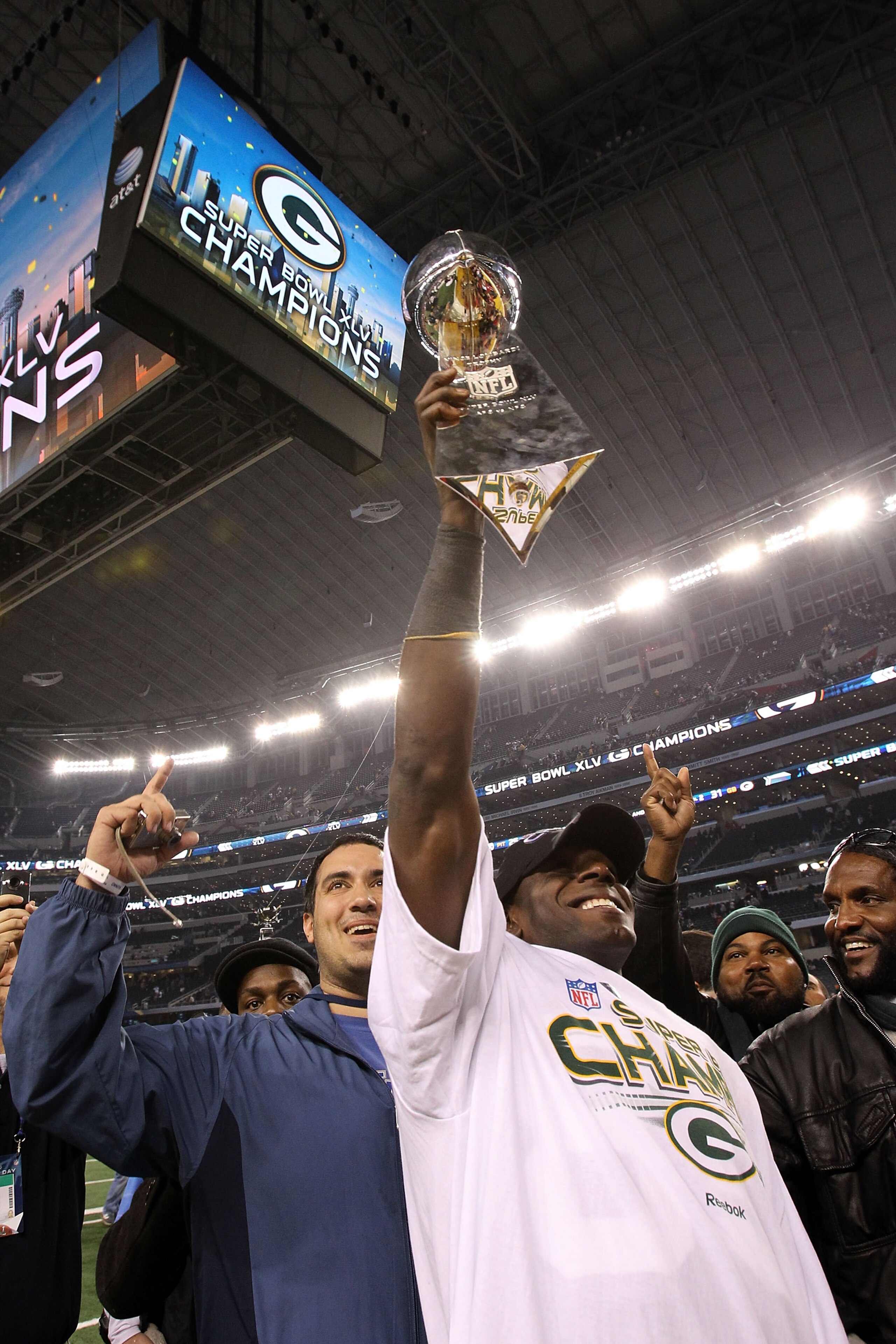 ARLINGTON, TX - FEBRUARY 06:  Donald Driver #80 of the Green Bay Packers celebrates with the Vince Lombardi Trophy after they defeated the Pittsburgh Steelers 31 to 25 in Super Bowl XLV at Cowboys Stadium on February 6, 2011 in Arlington, Texas.  (Photo b