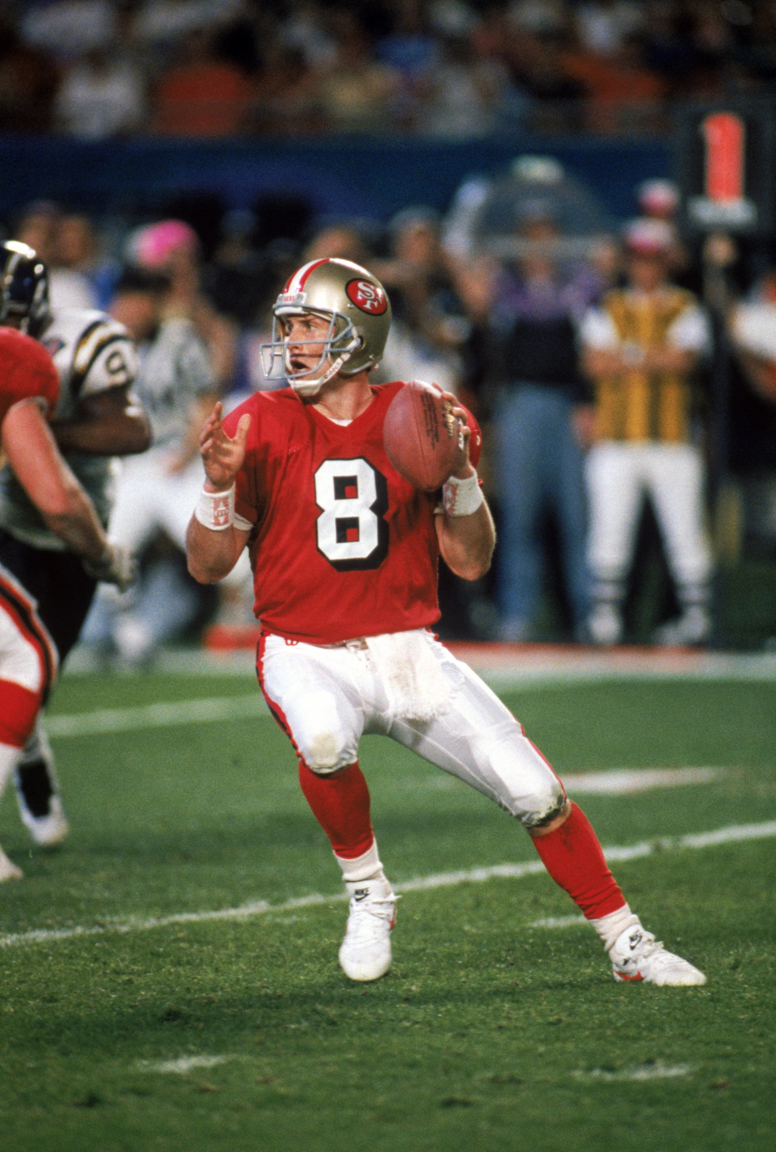 MIAMI - JANUARY 29:  Quarterback Steve Young #8 of the San Francisco 49ers drops back to pass during Super Bowl XXIX against the San Diego Chargers at Joe Robbie Stadium on January 29, 1995 in Miami, Florida. The 49ers won 49-26. (Photo by George Rose/Get