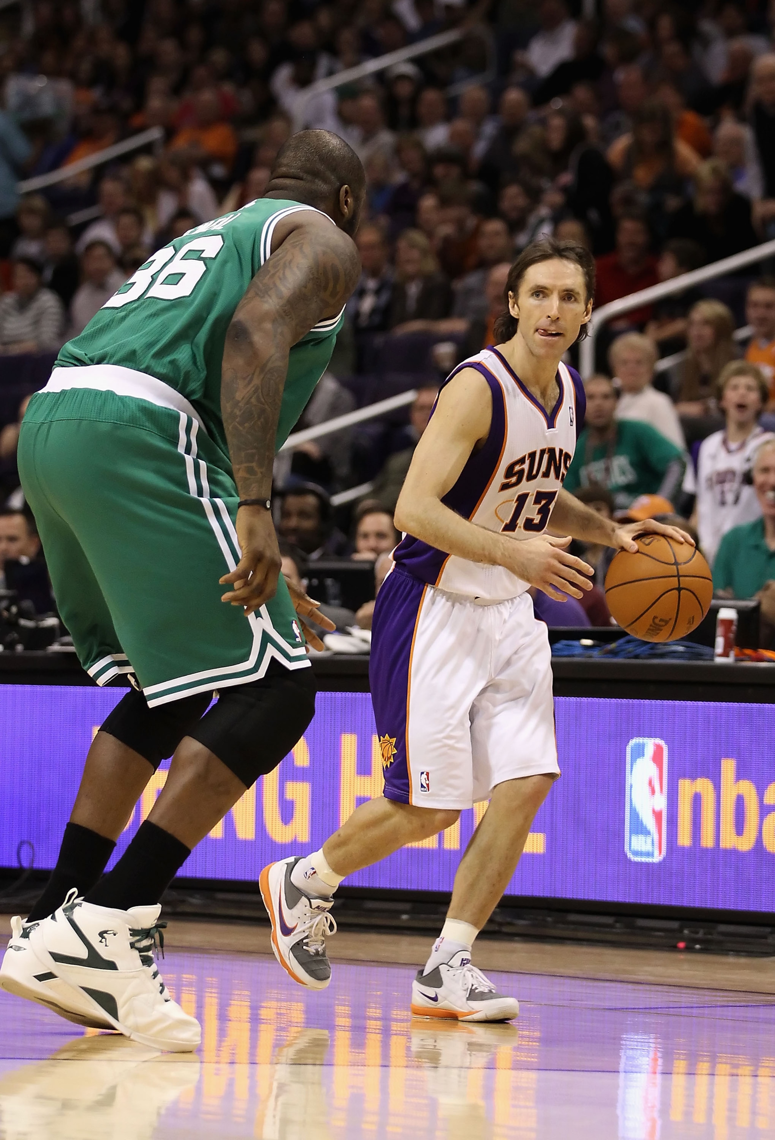PHOENIX, AZ - JANUARY 28:  Steve Nash #13 of the Phoenix Suns handles the ball during the NBA game against the Boston Celtics at US Airways Center on January 28, 2011 in Phoenix, Arizona.  The Suns defeated the Celtics 88-71.  NOTE TO USER: User expressly