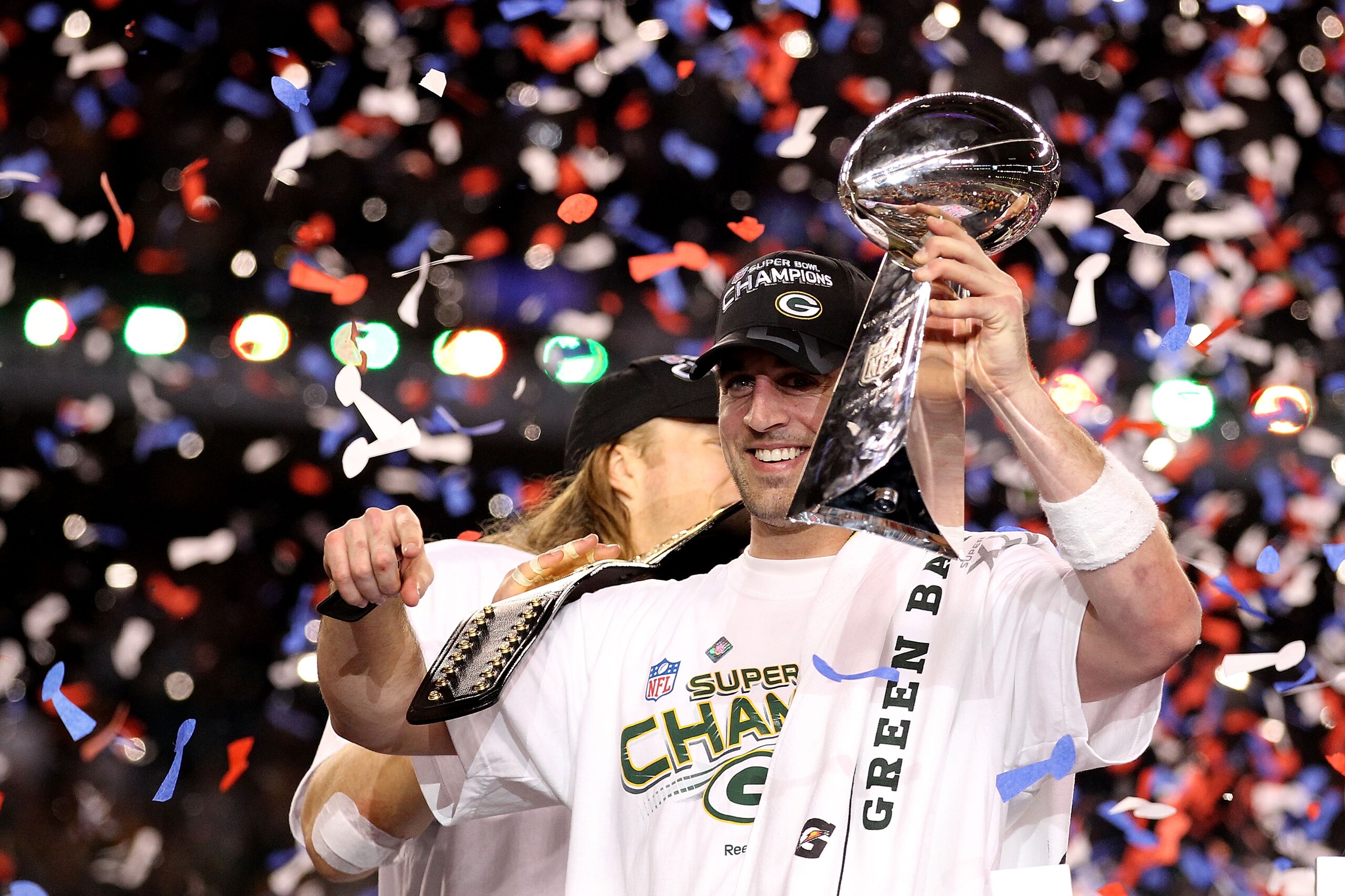 ARLINGTON, TX - FEBRUARY 06:  MVP Aaron Rodgers #12 of the Green Bay Packers celebrates with the Lombardi Trophy after winning Super Bowl XLV against the Pittsburgh Steelers at Cowboys Stadium on February 6, 2011 in Arlington, Texas.  (Photo by Al Bello/G