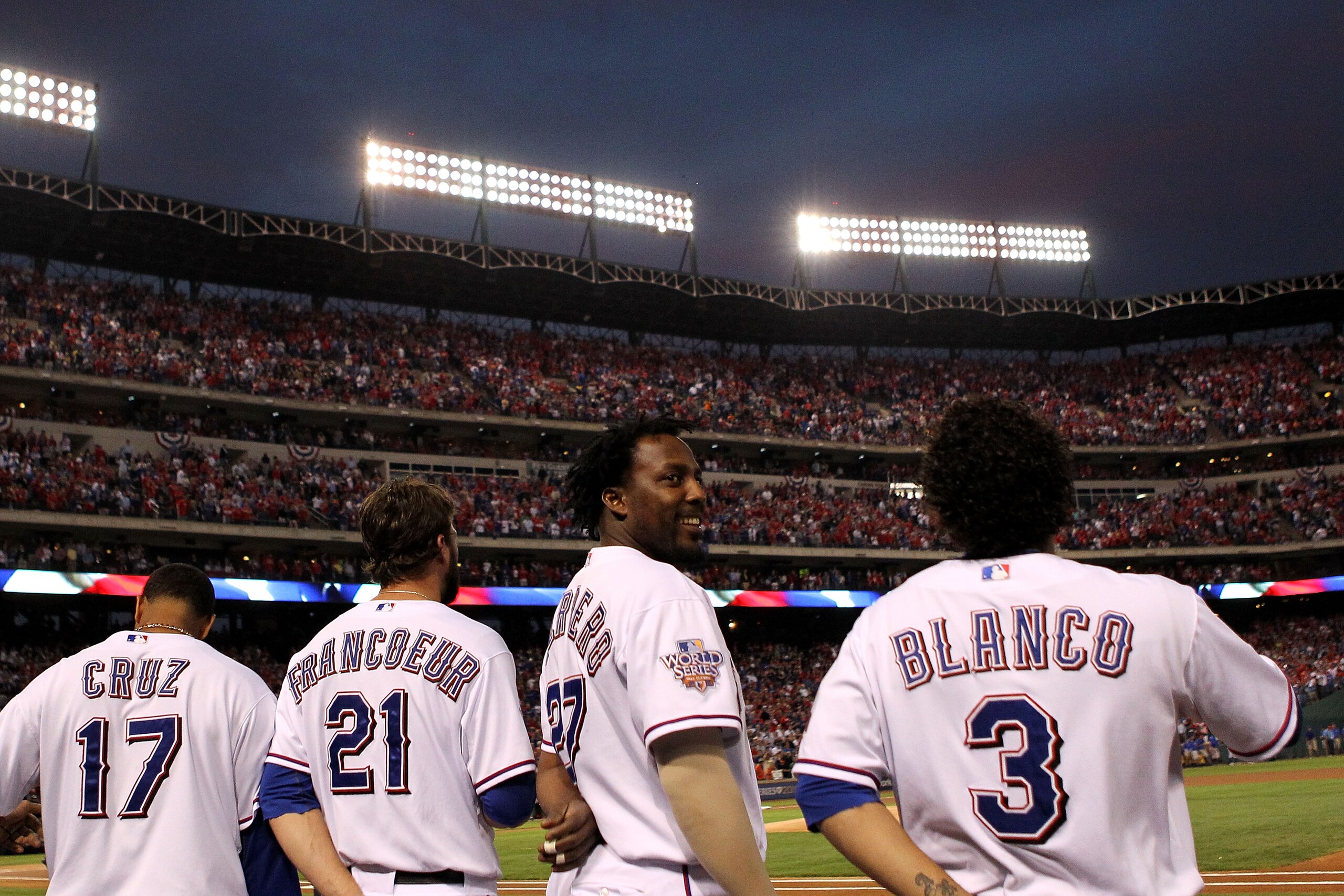 ARLINGTON, TX - NOVEMBER 01: (L-R) Nelson Cruz #17, Jeff Francoeur #21, Vladimir Guerrero #27 and Elvis Andrus #1 of the Texas Rangers stand for the performance of the National Anthem against the San Francisco Giants in Game Five of the 2010 MLB World Se ARLINGTON, TX - NOVEMBER 01: (L-R) Nelson Cruz #17, Jeff Francoeur #21, Vladimir Guerrero #27 and Elvis Andrus #1 of the Texas Rangers stand for the performance of the National Anthem against the San Francisco Giants in Game Five of the 2010 MLB World Se
