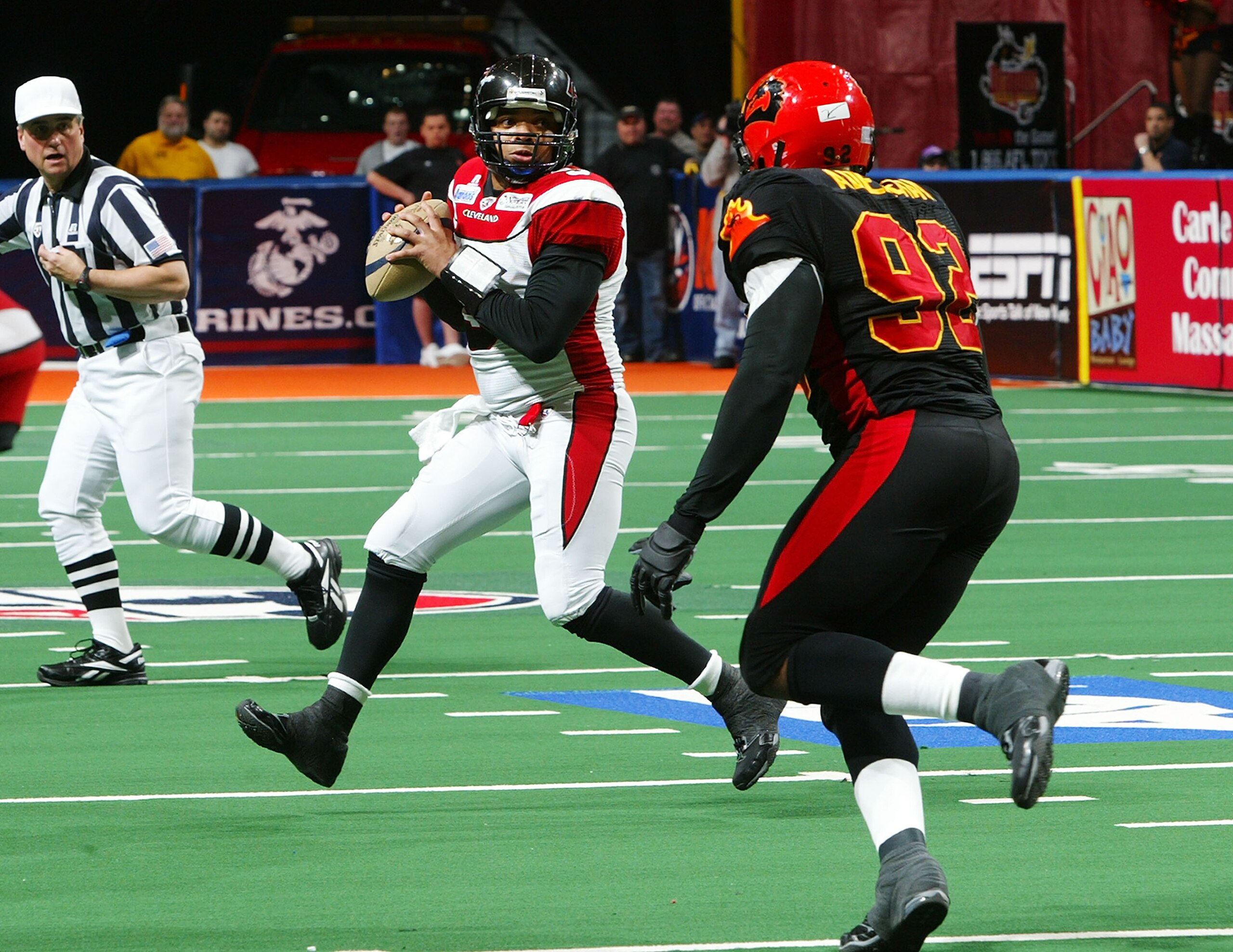 UNIONDALE, NY - APRIL 26:  Raymond Philyaw #9 of the Cleveland Gladiators looks to pass the ball against  Farouk Adelekan #92 of the New York Dragons on April 26, 2008 at Nassau Coliseum in Uniondale, New York.  Dragons defeat Gladiators 56-39  (Photo by
