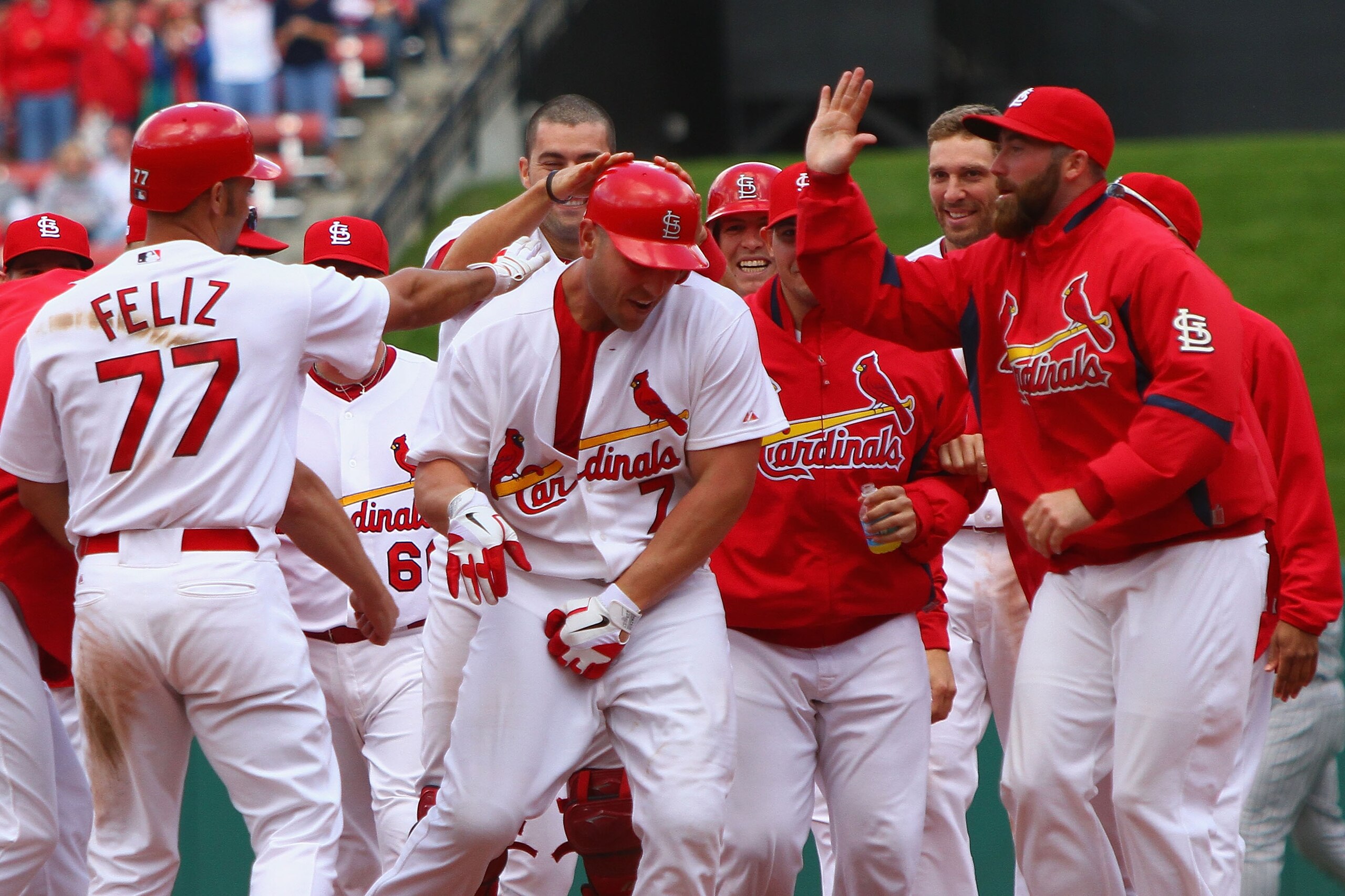 ST. LOUIS - OCTOBER 2: Matt Holliday #7 of the St. Louis Cardinals is congratulated by teammates after hitting a walk-off single against the Colorado RockiesI at Busch Stadium on October 2, 2010 in St. Louis, Missouri.  The Cardinals beat the Rockies 1-0