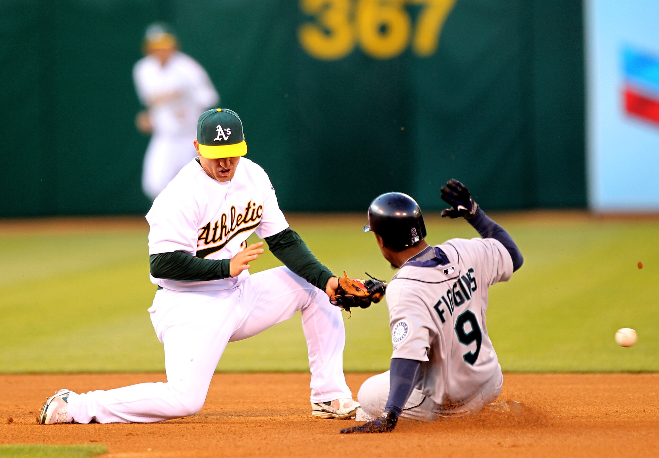OAKLAND, CA - APRIL 05: Chone Figgins #9 of the Seattle Mariners safely steals second base as the ball gets past Cliff Pennington #2 of the Oakland Athletics on Opening Day at the Oakland-Alameda County Coliseum on April 5, 2010 in Oakland, California. OAKLAND, CA - APRIL 05: Chone Figgins #9 of the Seattle Mariners safely steals second base as the ball gets past Cliff Pennington #2 of the Oakland Athletics on Opening Day at the Oakland-Alameda County Coliseum on April 5, 2010 in Oakland, California.