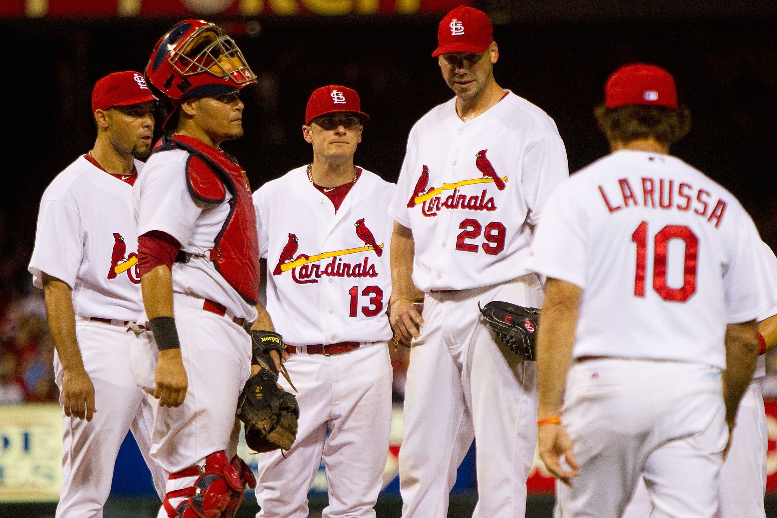 ST. LOUIS - AUGUST 21: Starter Chris Carpenter #29 of the St. Louis Cardinals is removed from the by Cardinals manager Tony LaRussa #10 against the San Francisco Giants at Busch Stadium on August 21, 2010 in St. Louis, Missouri.  (Photo by Dilip Vishwanat