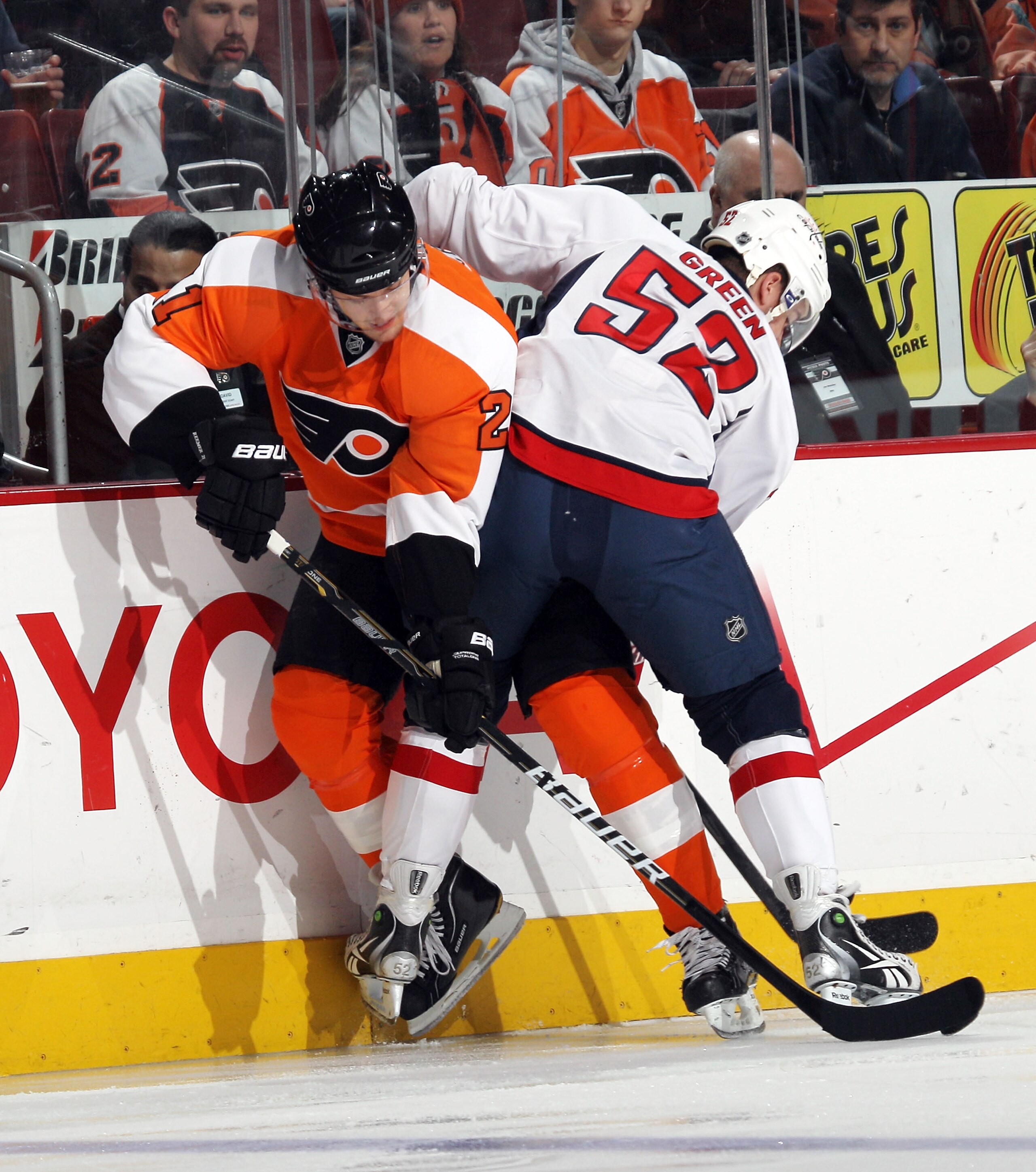 PHILADELPHIA, PA - JANUARY 18: Mike Green #52 of the Washington Capitals hits James van Riemsdyk #21 of the Philadelphia Flyers into the boards at the Wells Fargo Center on January 18, 2011 in Philadelphia, Pennsylvania. (Photo by Bruce Bennett/Getty Imag PHILADELPHIA, PA - JANUARY 18: Mike Green #52 of the Washington Capitals hits James van Riemsdyk #21 of the Philadelphia Flyers into the boards at the Wells Fargo Center on January 18, 2011 in Philadelphia, Pennsylvania. (Photo by Bruce Bennett/Getty Imag