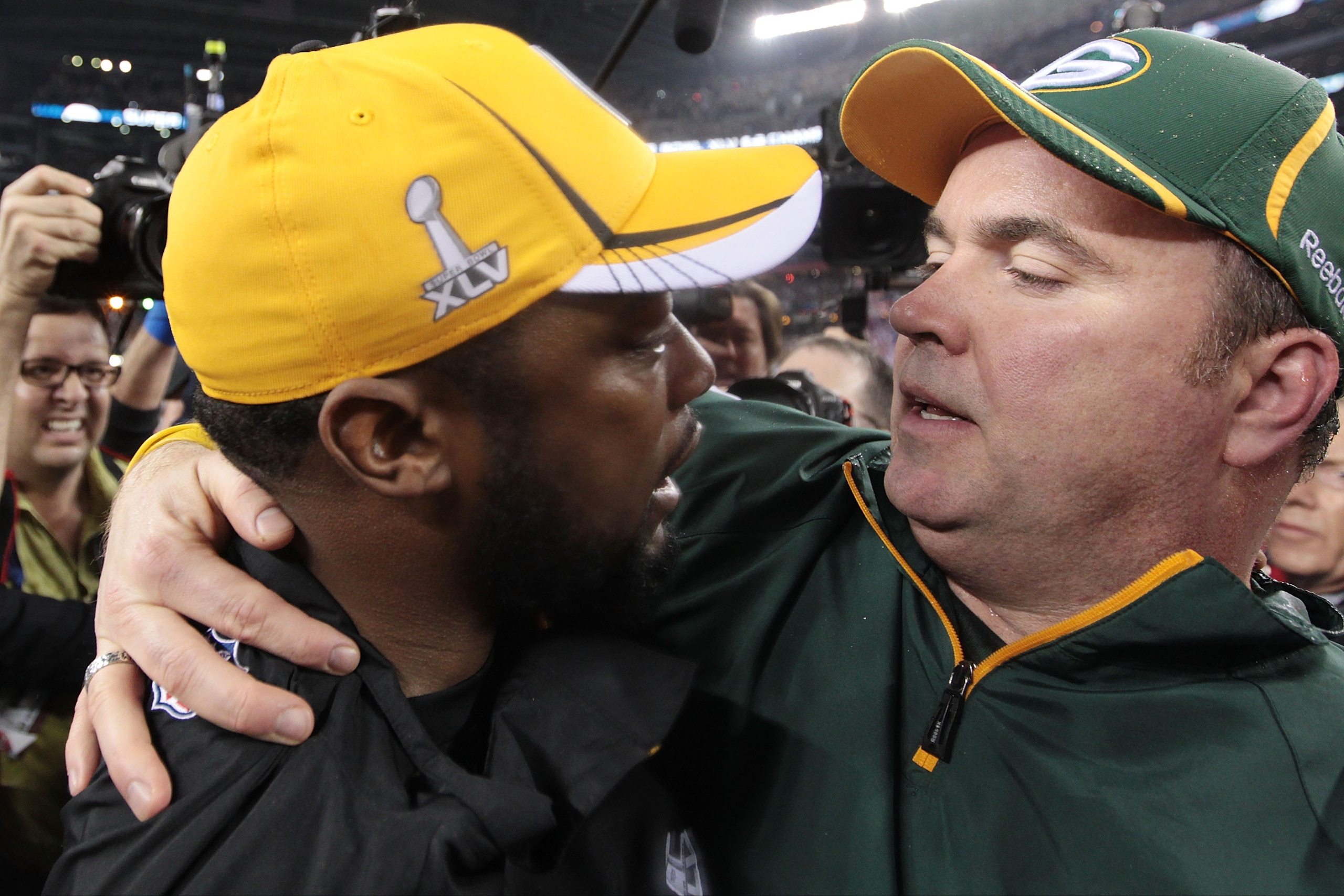 ARLINGTON, TX - FEBRUARY 06:  Head coach Mike McCarthy of the Green Bay Packers is congratulated by head coach Mike Tomlin of the Pittsburgh Steelers after the Packers defeated the Steelers 31 to 25 during Super Bowl XLV at Cowboys Stadium on February 6,