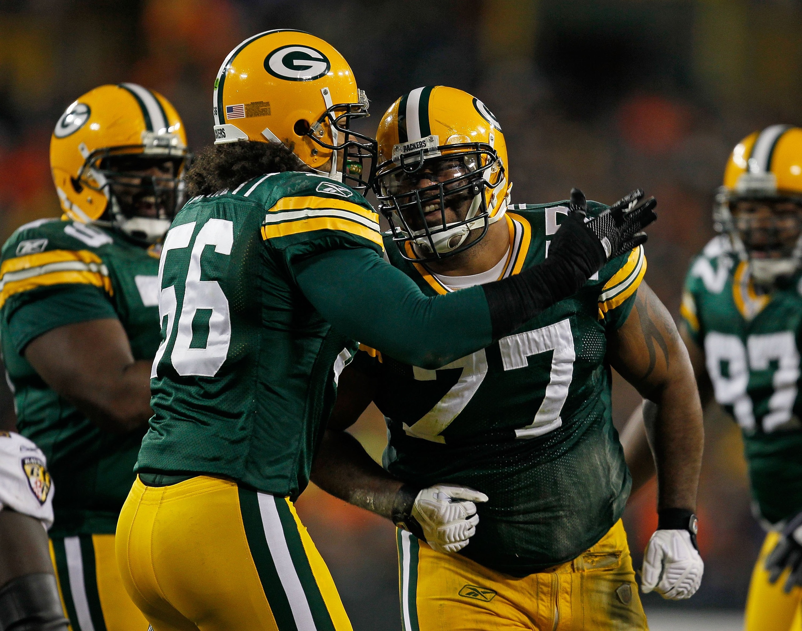 GREEN BAY, WI - DECEMBER 07: Nick Barnett #56 of the Green Bay Packers celebrates a defensive play with Cullen Jenkens #77 against the Baltimore Ravens at Lambeau Field on December 7, 2009 in Green Bay, Wisconsin. The Packers defeated the Ravens 27-17. (P GREEN BAY, WI - DECEMBER 07: Nick Barnett #56 of the Green Bay Packers celebrates a defensive play with Cullen Jenkens #77 against the Baltimore Ravens at Lambeau Field on December 7, 2009 in Green Bay, Wisconsin. The Packers defeated the Ravens 27-17. (P