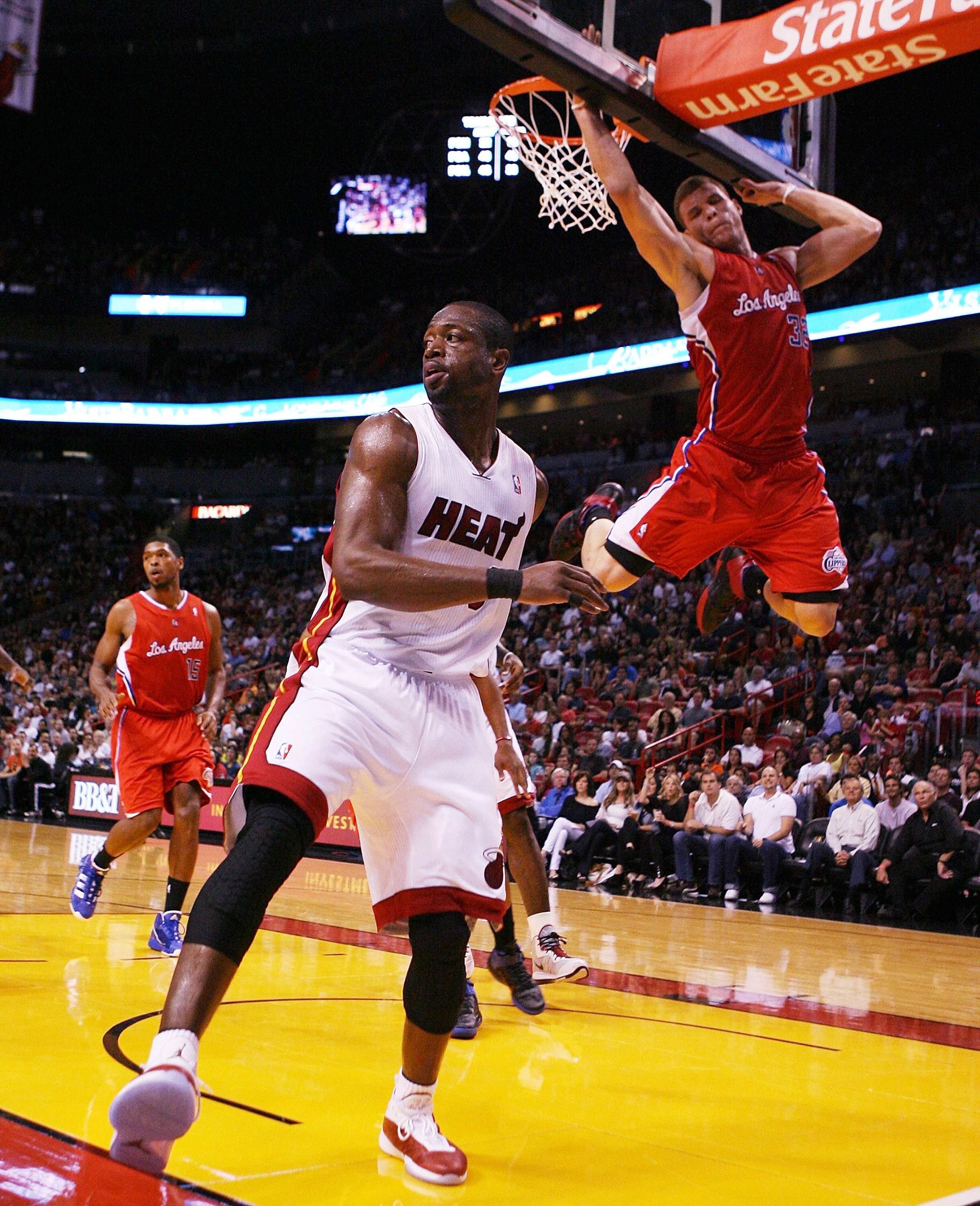MIAMI - FEBRUARY 06:  Guard Dwyane Wade #3 of the Miami Heat passes against guard Forward Blake Griffin #32 of the L.A. Clippers at American Airlines Arena on February 6, 2011 in Miami, Florida. NOTE TO USER: User expressly acknowledges and agrees that, b