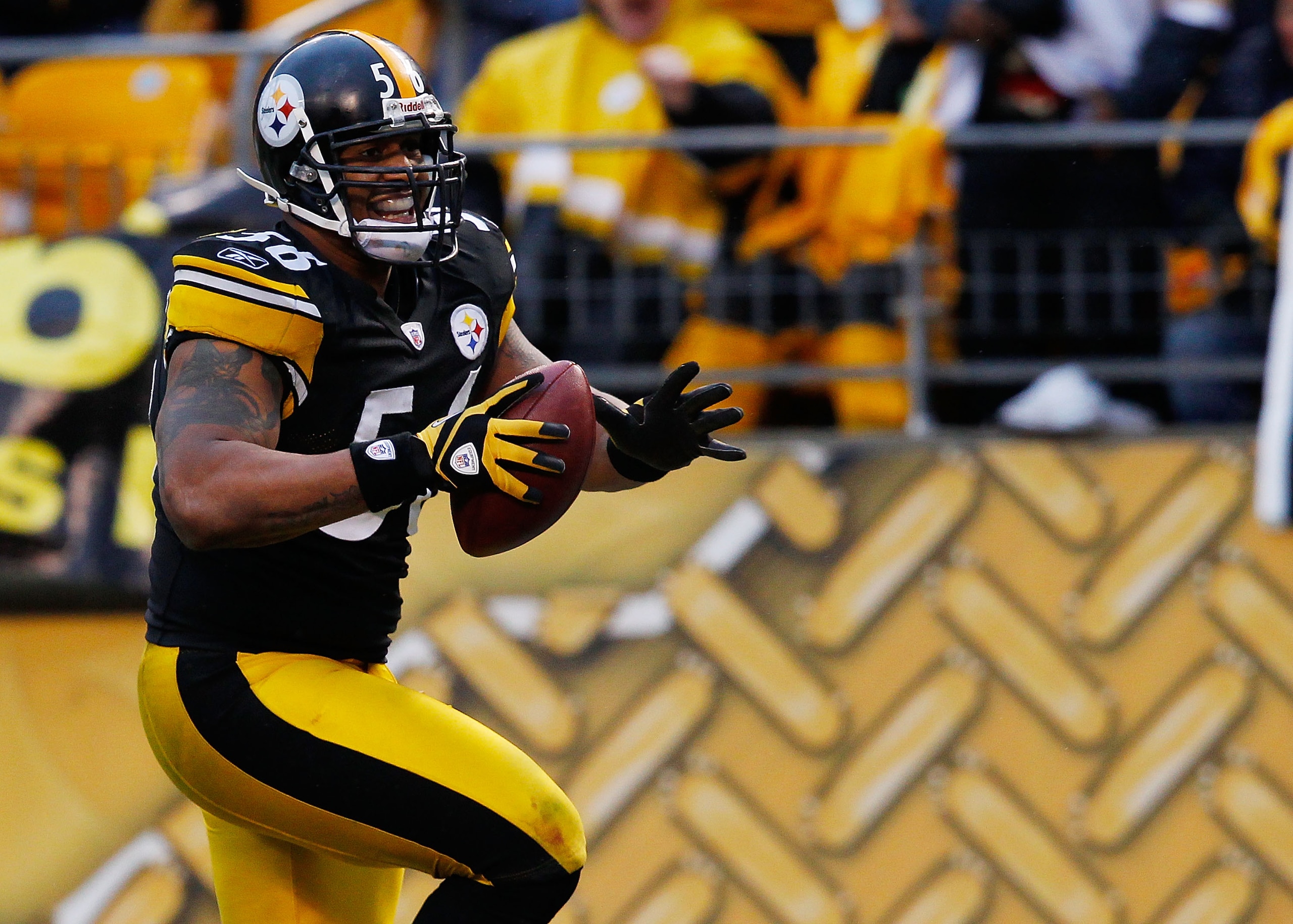 PITTSBURGH - DECEMBER 12: LaMarr Woodley #56 of the Pittsburgh Steelers returns an interception for a touchdown against the Cincinnati Bengals during the game on December 12, 2010 at Heinz Field in Pittsburgh, Pennsylvania. (Photo by Jared Wickerham/Get PITTSBURGH - DECEMBER 12: LaMarr Woodley #56 of the Pittsburgh Steelers returns an interception for a touchdown against the Cincinnati Bengals during the game on December 12, 2010 at Heinz Field in Pittsburgh, Pennsylvania. (Photo by Jared Wickerham/Get