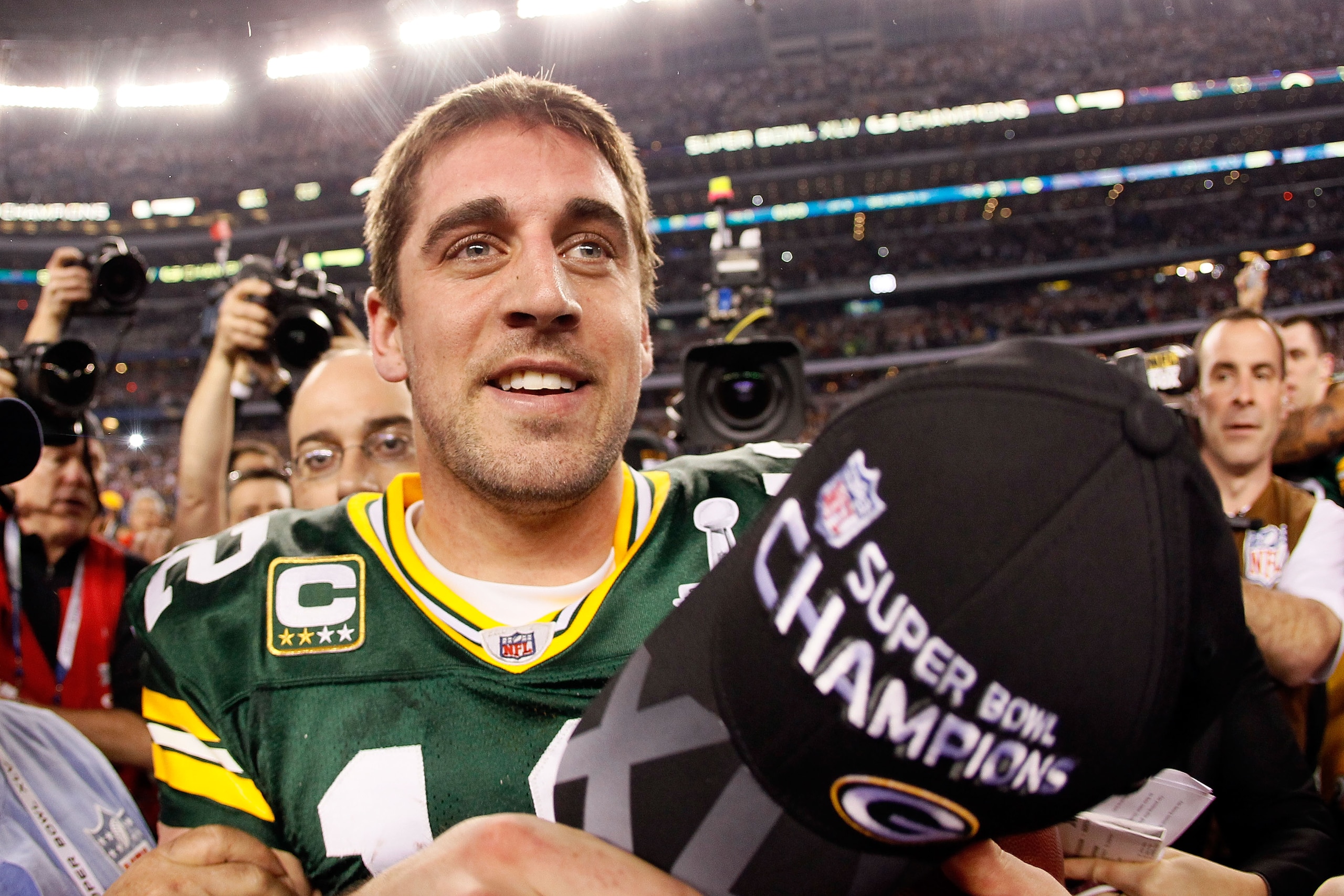 ARLINGTON, TX - FEBRUARY 06:  Super Bowl MVP Aaron Rodgers #12 of the Green Bay Packers celebrates after winning Super Bowl XLV 31-25 against the Pittsburgh Steelers at Cowboys Stadium on February 6, 2011 in Arlington, Texas.  (Photo by Kevin C. Cox/Getty