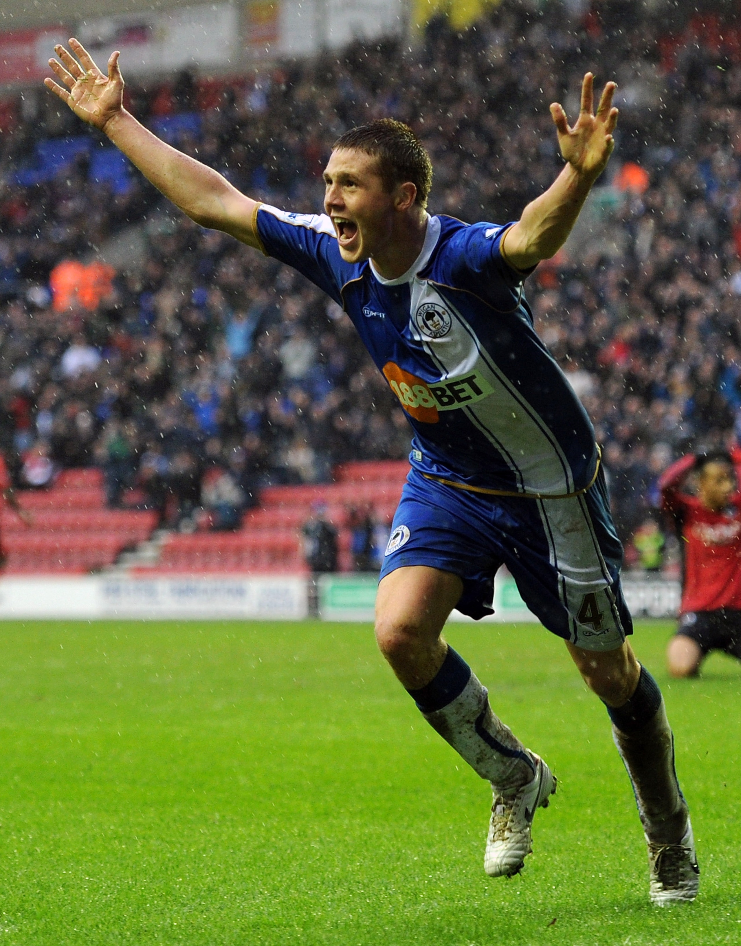 WIGAN, ENGLAND - FEBRUARY 05:  James McCarthy of Wigan Athletic celebrates after scoring to make it 1-1 during the Barclays Premier League match between Wigan Athletic and Blackburn Rovers at DW Stadium on February 5, 2011 in Wigan, England.  (Photo by Ch