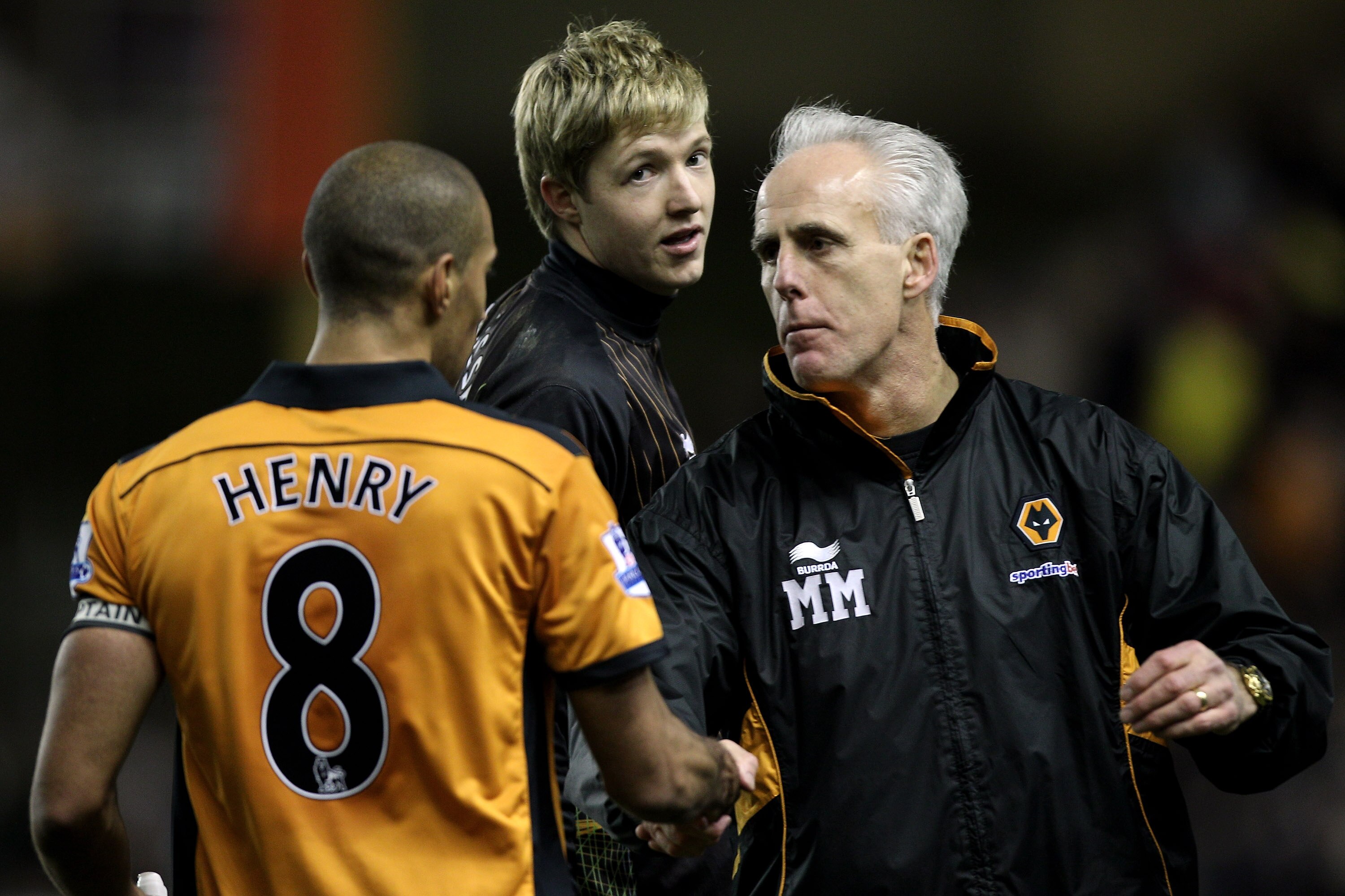 WOLVERHAMPTON, ENGLAND - FEBRUARY 05:  Mick McCarthy (R) manager of Wolves congratulates Karl Henry (L) of Wolves as goalkeeper Wayne Hennessey (C) looks on after the Barclays Premier League match between Wolverhampton Wanderers and Manchester United at M