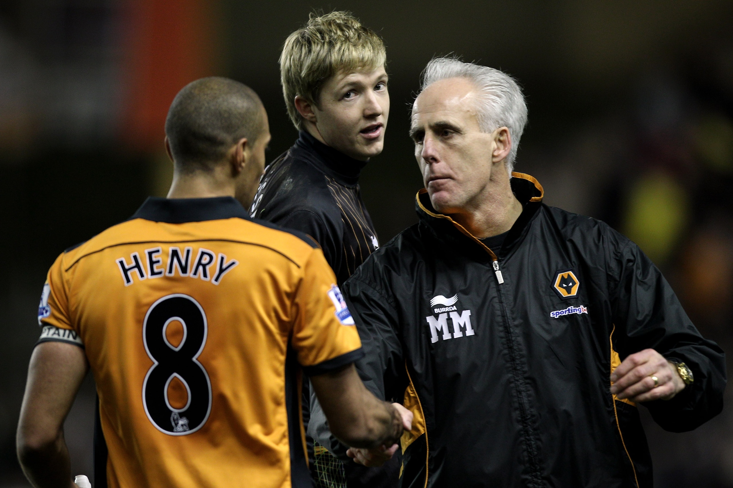 WOLVERHAMPTON, ENGLAND - FEBRUARY 05:  Mick McCarthy (R) manager of Wolves congratulates Karl Henry (L) of Wolves as goalkeeper Wayne Hennessey (C) looks on after the Barclays Premier League match between Wolverhampton Wanderers and Manchester United at M