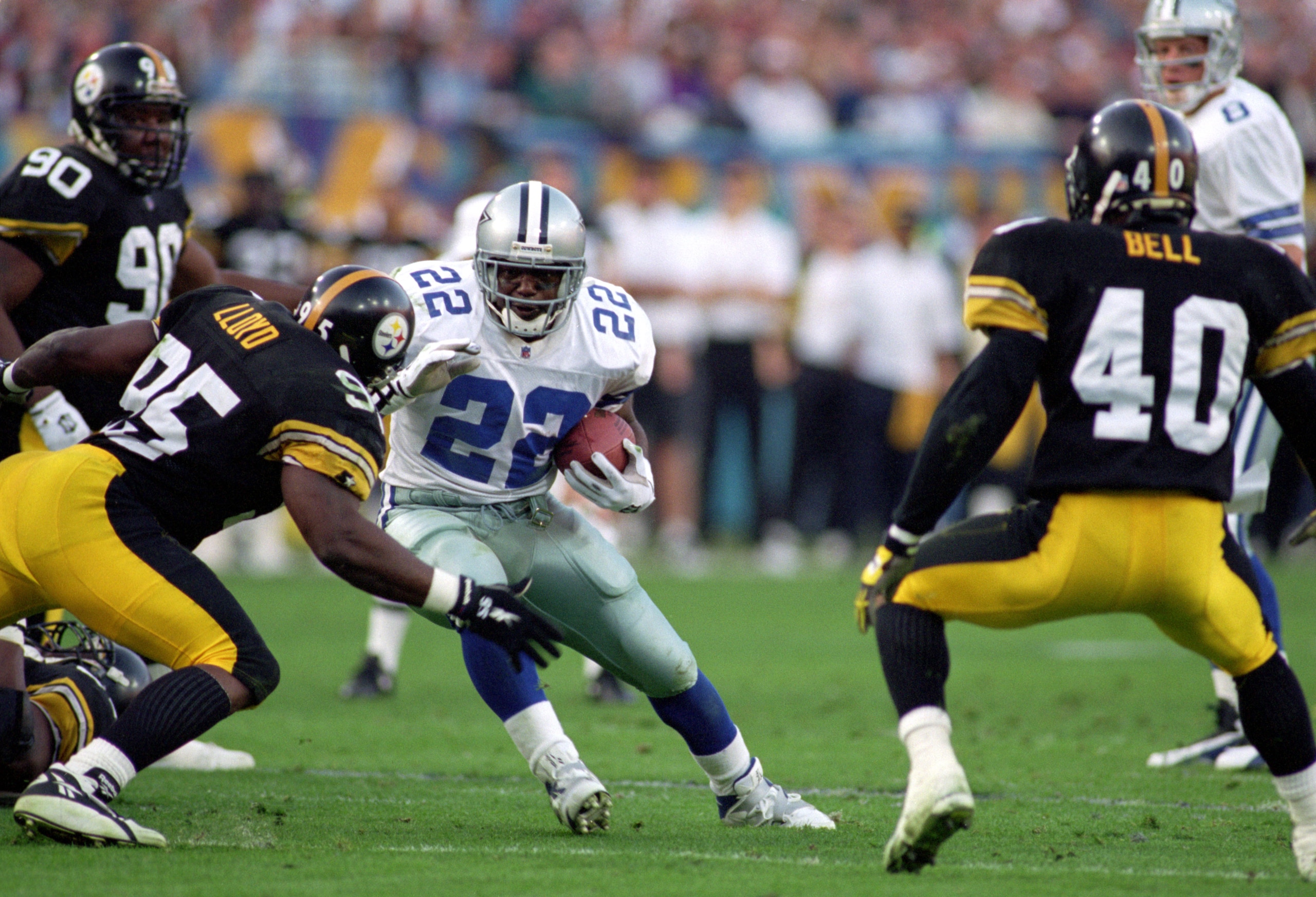 TEMPE, AZ - JANUARY 28:  Running back Emmitt Smith #22 of the Dallas Cowboys battles for yards during Super Bowl XXX against the Pittsburgh Steelers at Sun Devil Stadium on January 28, 1996 in Tempe, Arizona.  The Cowboys won 27-17.  (Photo by George Rose