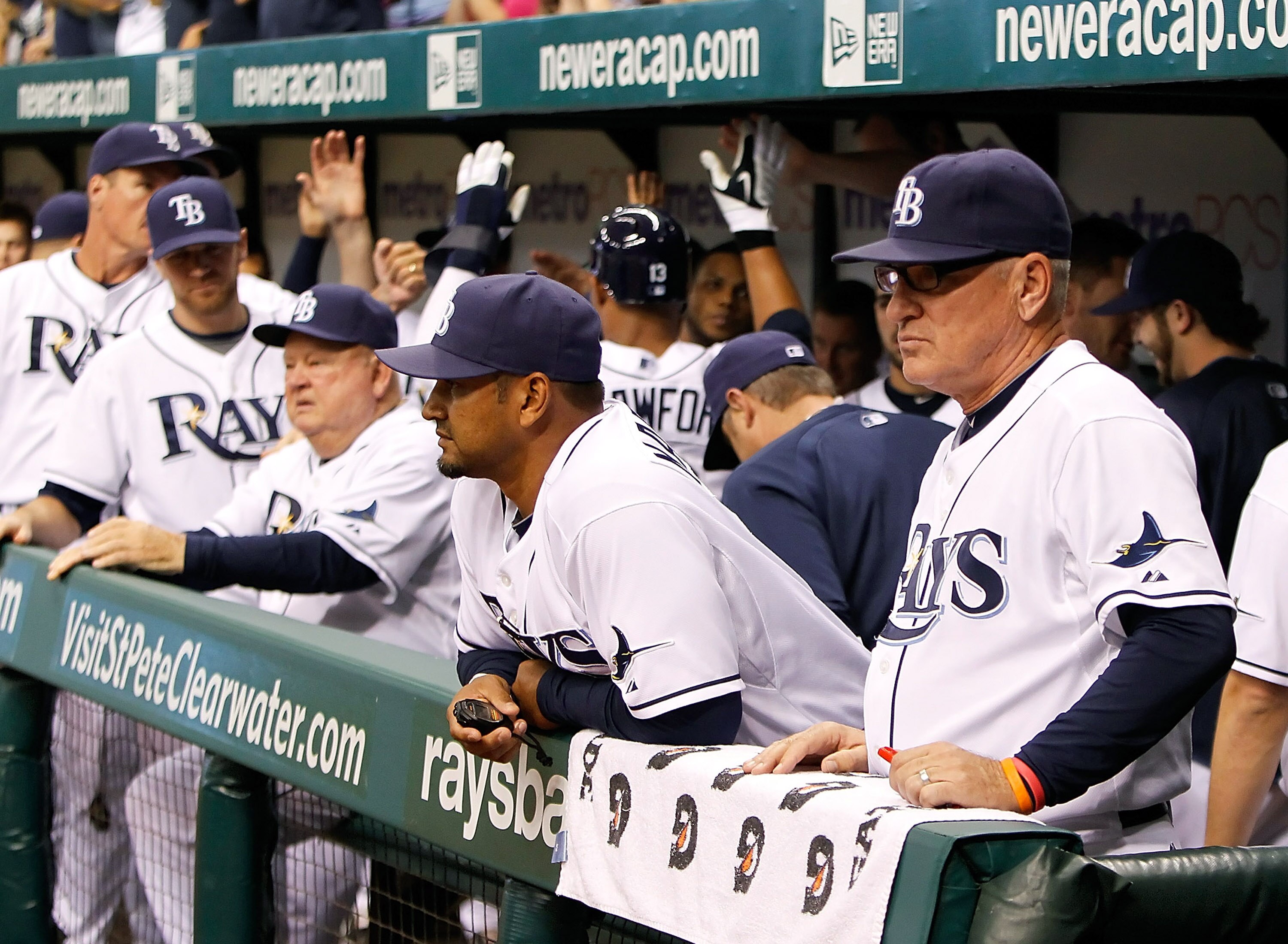 ST. PETERSBURG, FL - SEPTEMBER 28:  Manager Joe Maddon #70 of the Tampa Bay Rays watches as his team celebrates a run against the Baltimore Orioles during the game at Tropicana Field on September 28, 2010 in St. Petersburg, Florida.  (Photo by J. Meric/Ge
