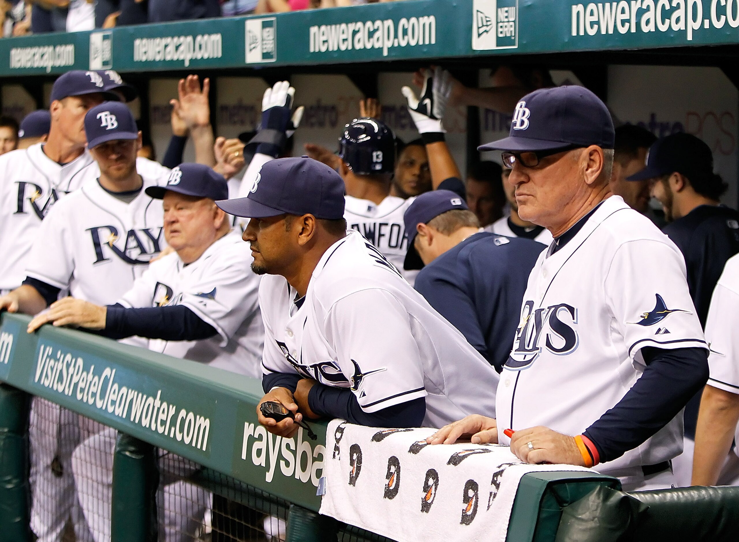 ST. PETERSBURG, FL - SEPTEMBER 28:  Manager Joe Maddon #70 of the Tampa Bay Rays watches as his team celebrates a run against the Baltimore Orioles during the game at Tropicana Field on September 28, 2010 in St. Petersburg, Florida.  (Photo by J. Meric/Ge