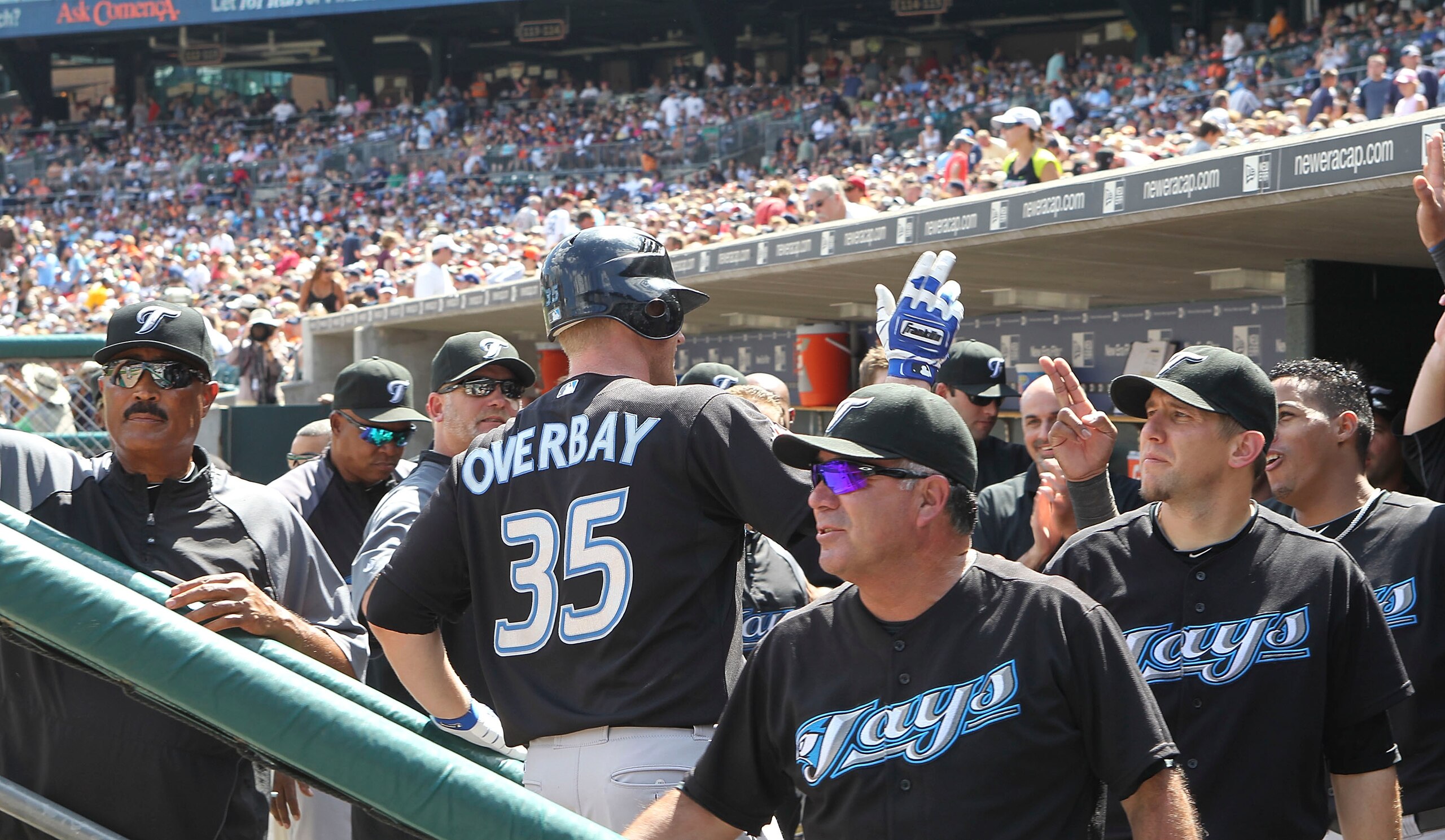DETROIT - JULY 25:  Lyle Overbay #35 of the Toronto Blue Jays celebrates his ninth inning game winning two run home run with his teammates in the dugout during the game against the Detroit Tigers on July 25, 2010 at Comerica Park in Detroit, Michigan. The
