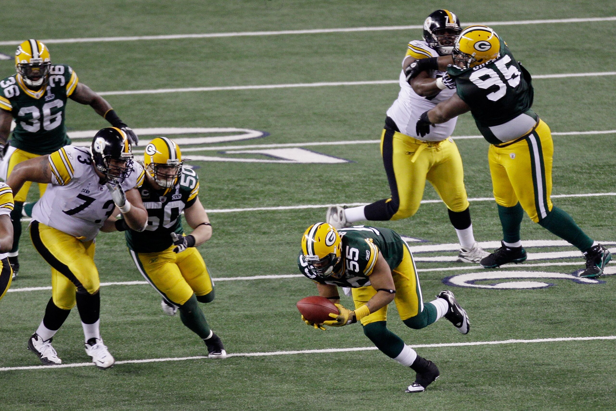 ARLINGTON, TX - FEBRUARY 06:  Desmond Bishop #55 of the Green Bay Packers recovers his fumble against the Pittsburgh Steelers during the fourth quarter of Super Bowl XLV at Cowboys Stadium on February 6, 2011 in Arlington, Texas.  (Photo by Rob Carr/Getty