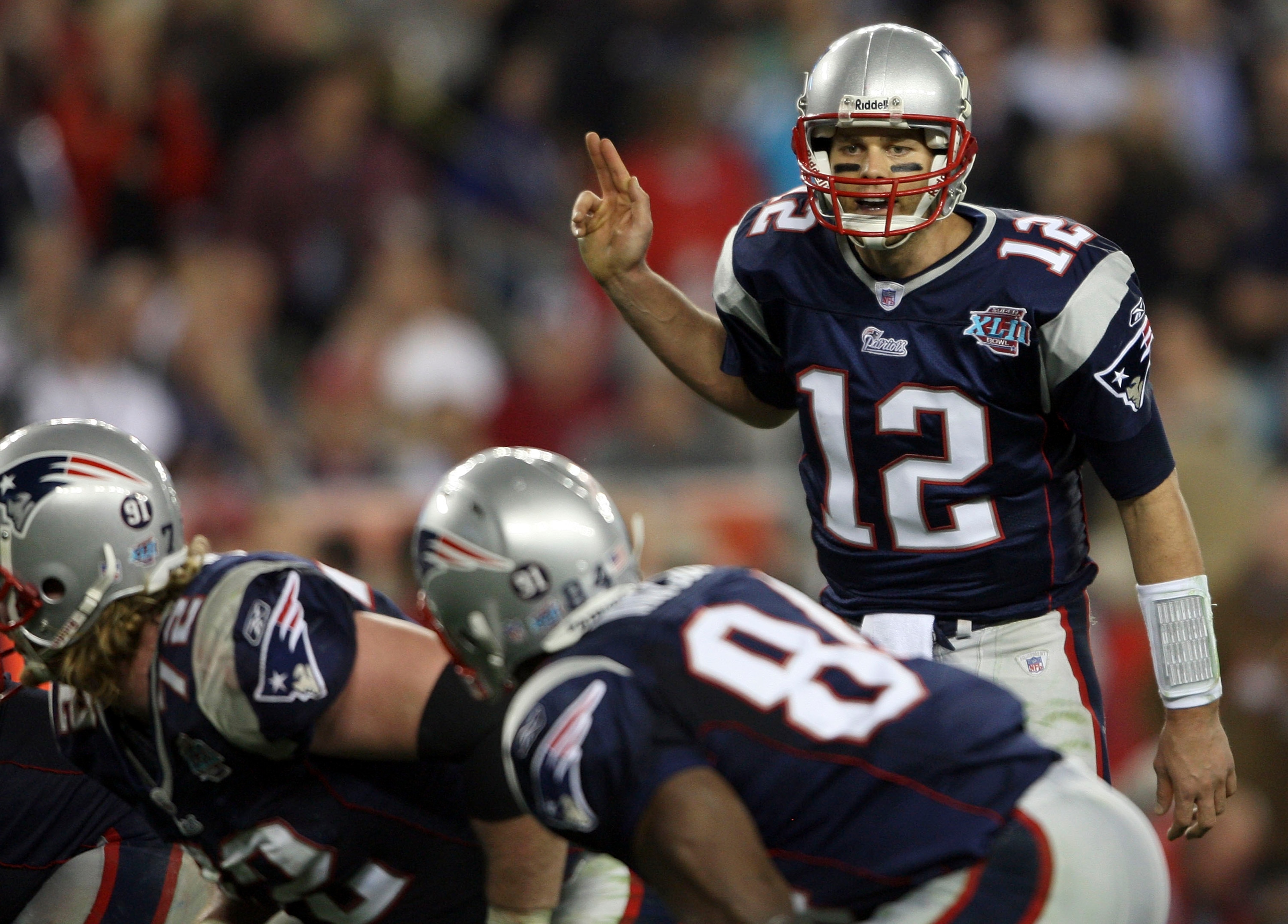 GLENDALE, AZ - FEBRUARY 03: Tom Brady #12 of of the New England Patriots calls out from under center in the fourth quarter of Super Bowl XLII against the New York Giants on February 3, 2008 at the University of Phoenix Stadium in Glendale, Arizona. (Pho GLENDALE, AZ - FEBRUARY 03: Tom Brady #12 of of the New England Patriots calls out from under center in the fourth quarter of Super Bowl XLII against the New York Giants on February 3, 2008 at the University of Phoenix Stadium in Glendale, Arizona. (Pho