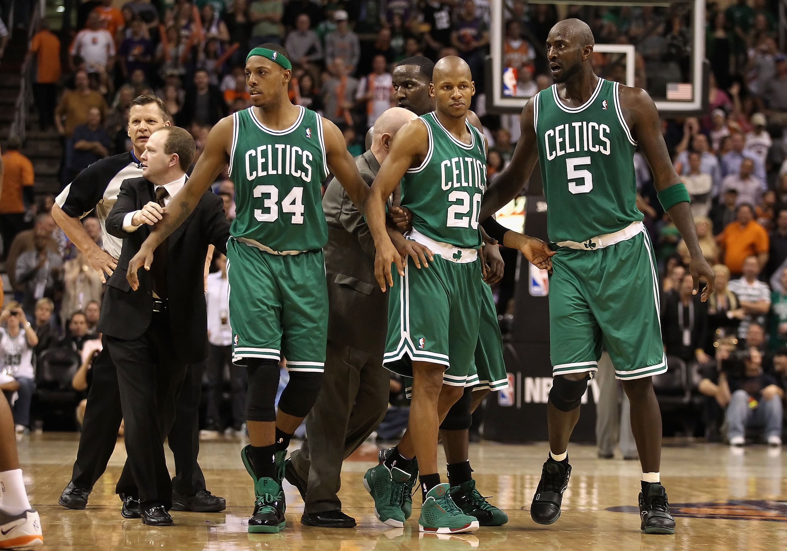 PHOENIX, AZ - JANUARY 28: Assistant coach Lawrence Frank of the Boston Celtics walks Paul Pierce #34, Ray Allen #20 and Kevin Garnett #5 back to the bench after an altercation against the Phoenix Suns during the NBA game at US Airways Center on January 2 PHOENIX, AZ - JANUARY 28: Assistant coach Lawrence Frank of the Boston Celtics walks Paul Pierce #34, Ray Allen #20 and Kevin Garnett #5 back to the bench after an altercation against the Phoenix Suns during the NBA game at US Airways Center on January 2