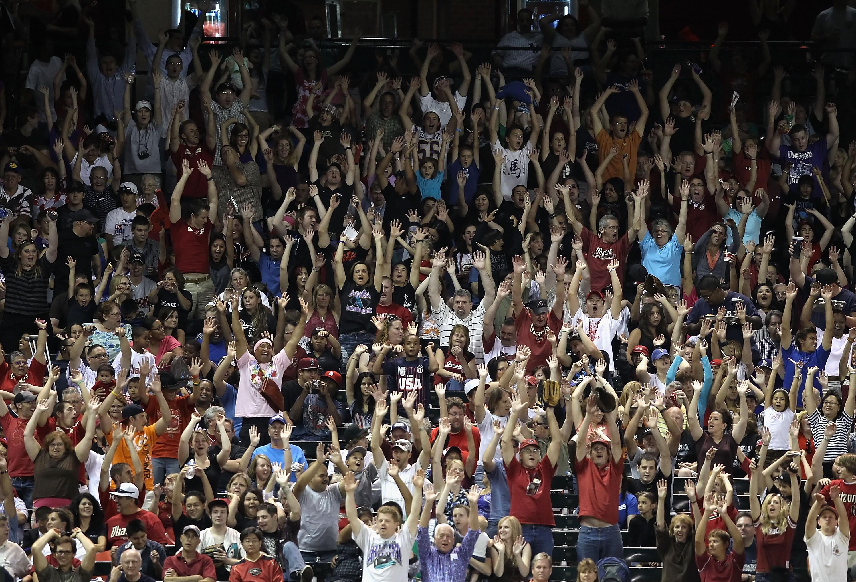 PHOENIX - SEPTEMBER 24:  Fans do the wave during the Major League Baseball game between the Los Angeles Dodgers and the Arizona Diamondbacks at Chase Field on September 24, 2010 in Phoenix, Arizona.  (Photo by Christian Petersen/Getty Images)