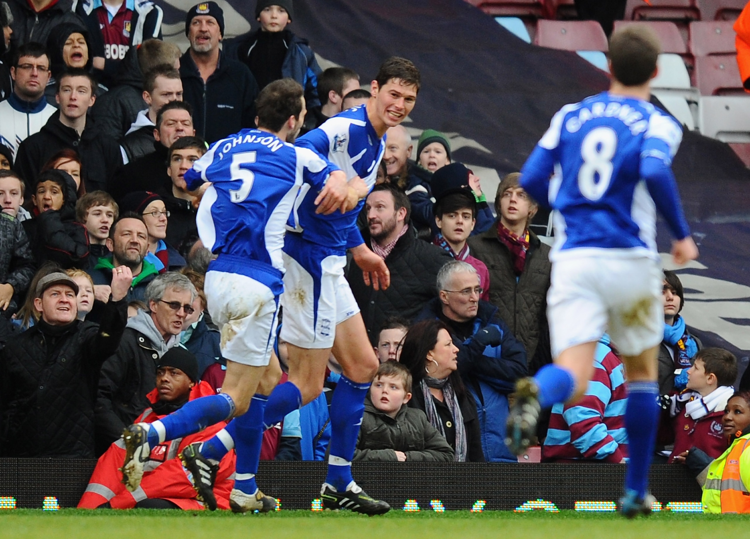 LONDON, ENGLAND - FEBRUARY 06:  Nikola Zigic of Birmingham City celebrates with teammates Roger Johnson (L) and Craig Gardner after scoring the opening goal during the Barclays Premier League match between West Ham United and Birmingham City at the Boleyn