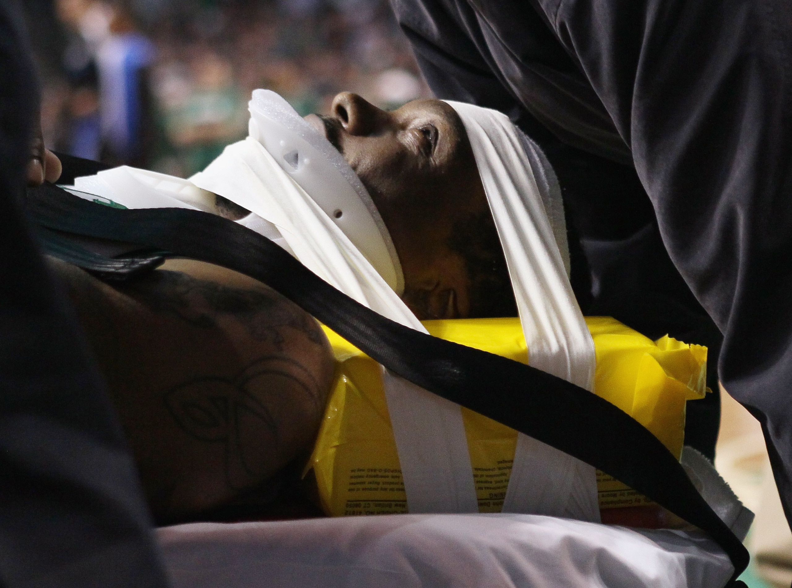 BOSTON, MA - FEBRUARY 06:  Marquis Daniels #8 the Boston Celtics is taken off the court on a stretcher after colliding with Gilbert Arenas #1 of the Orlando Magic on February 6, 2011 at the TD Garden in Boston, Massachusetts.  NOTE TO USER: User expressly