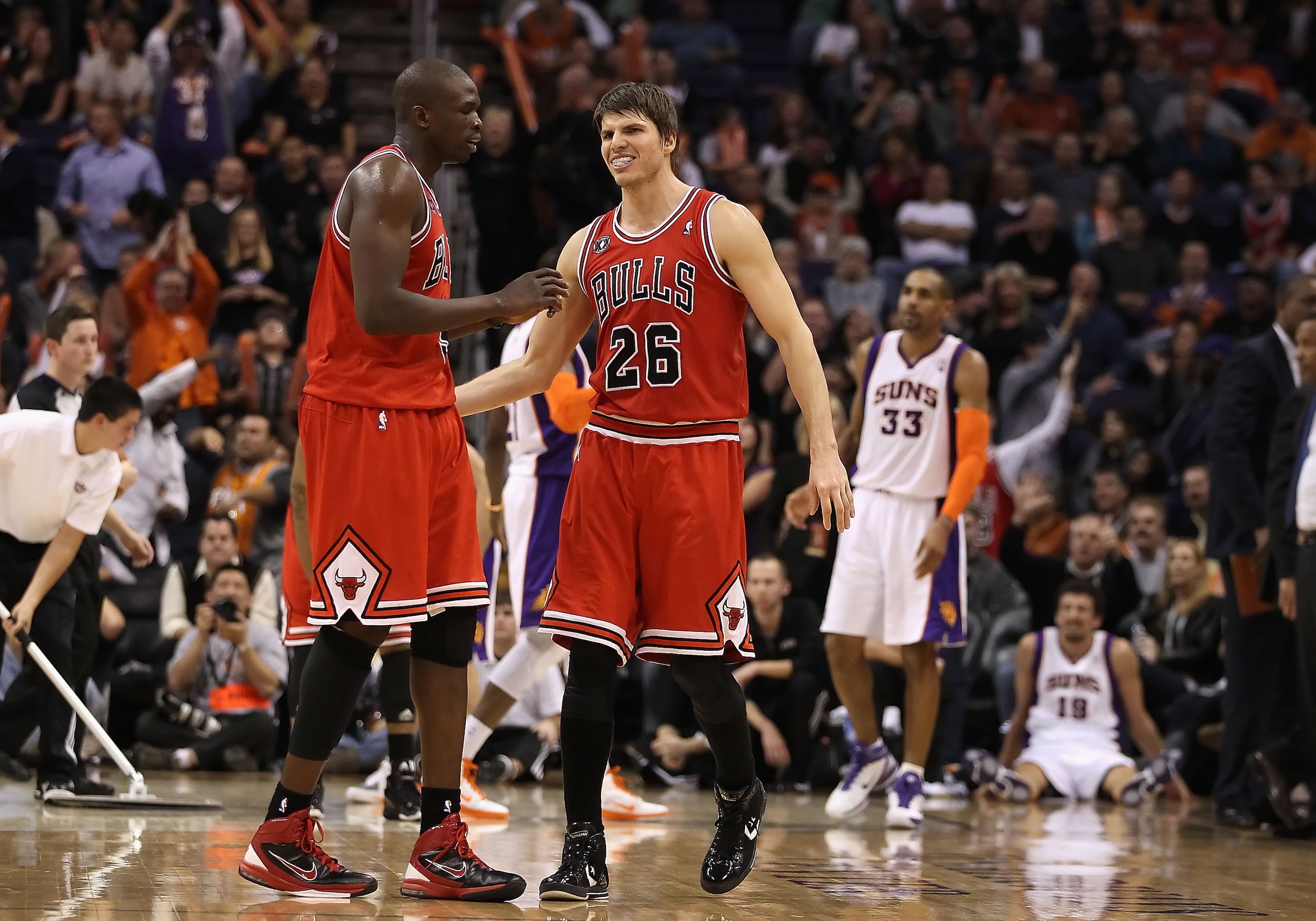 PHOENIX - NOVEMBER 24:  Luol Deng #9 and Kyle Korver #26 of the Chicago Bulls react after scoring against the Phoenix Suns late in overtime of the NBA game at US Airways Center on November 24, 2010 in Phoenix, Arizona. The Bulls defeated the Suns 123-115
