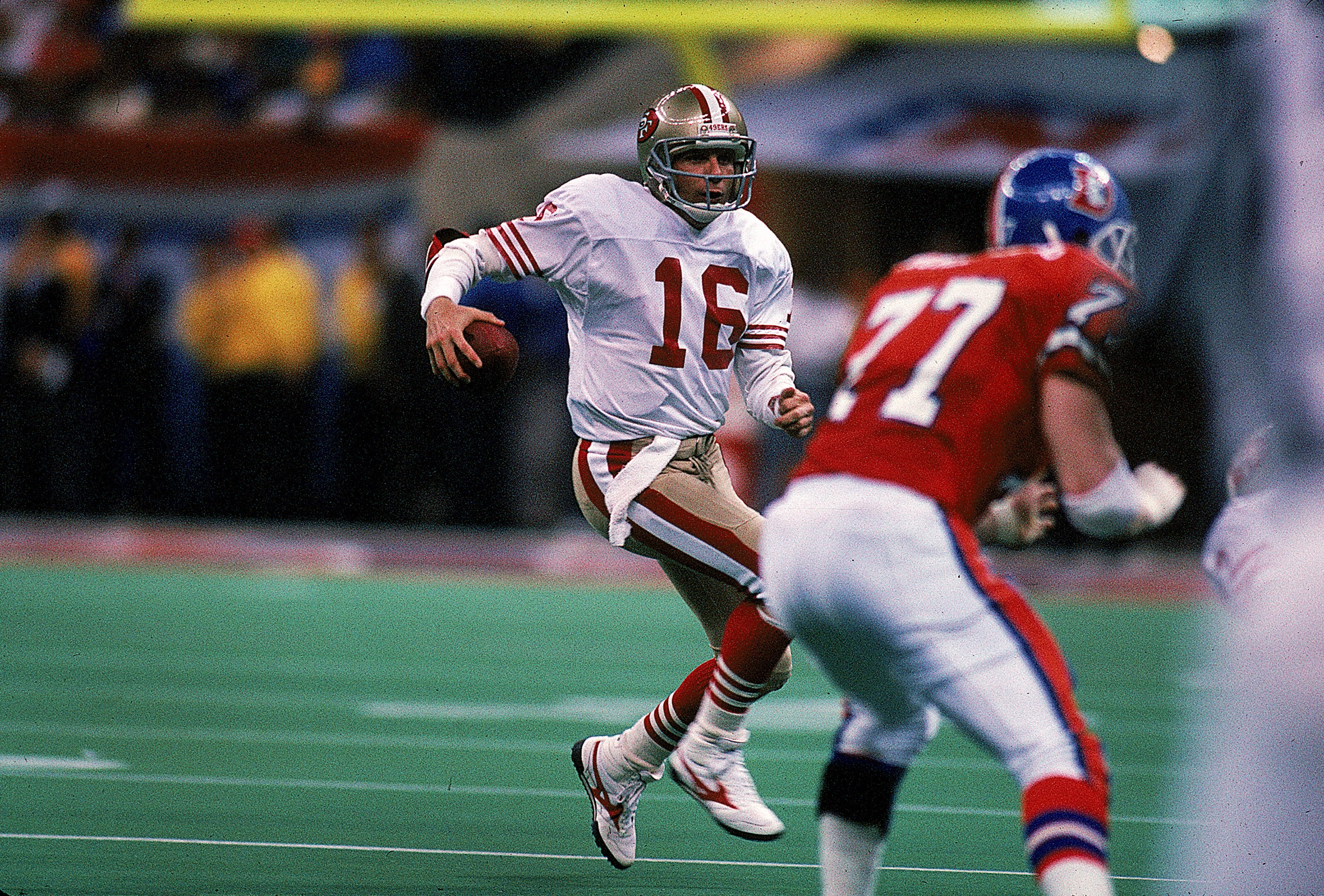 28 Jan 1990:  Quarterback Joe Montana #16 of the San Francisco 49ers in action during the NFL Super Bowl XXIV Game against Denver Broncos at the Louisiana Superdome in New Orleans, Louisiana. The 49ers defeated the Broncos 55-10. Mandatory Credit: Rick St