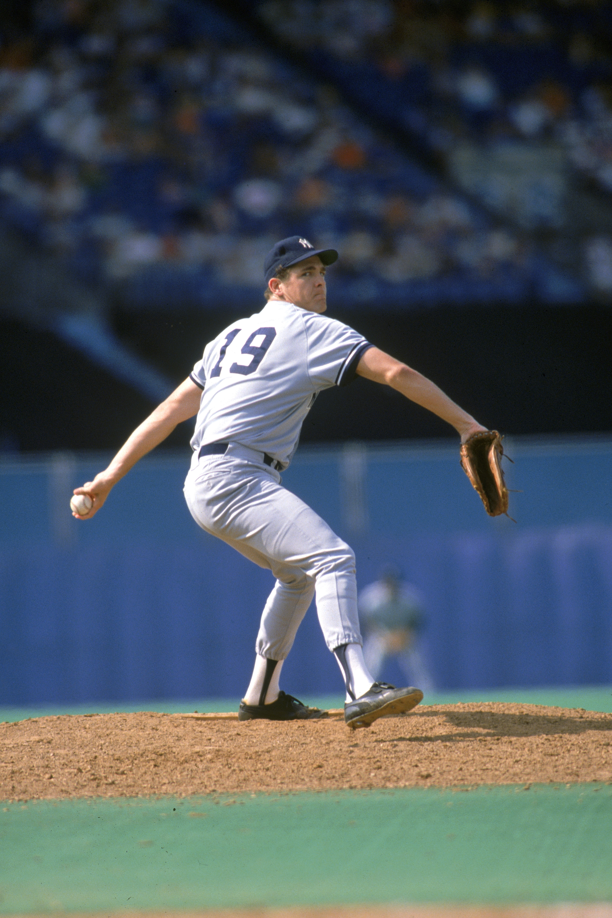 TORONTO - 1988:  Pitcher Dave Righetti #19 of the New York Yankees pitches during the game against the Toronto Blue Jays at Exhibition Stadium during the 1988 season in Toronto, Ontario, Canada.  (Photo by Rick Stewart/Getty Images)