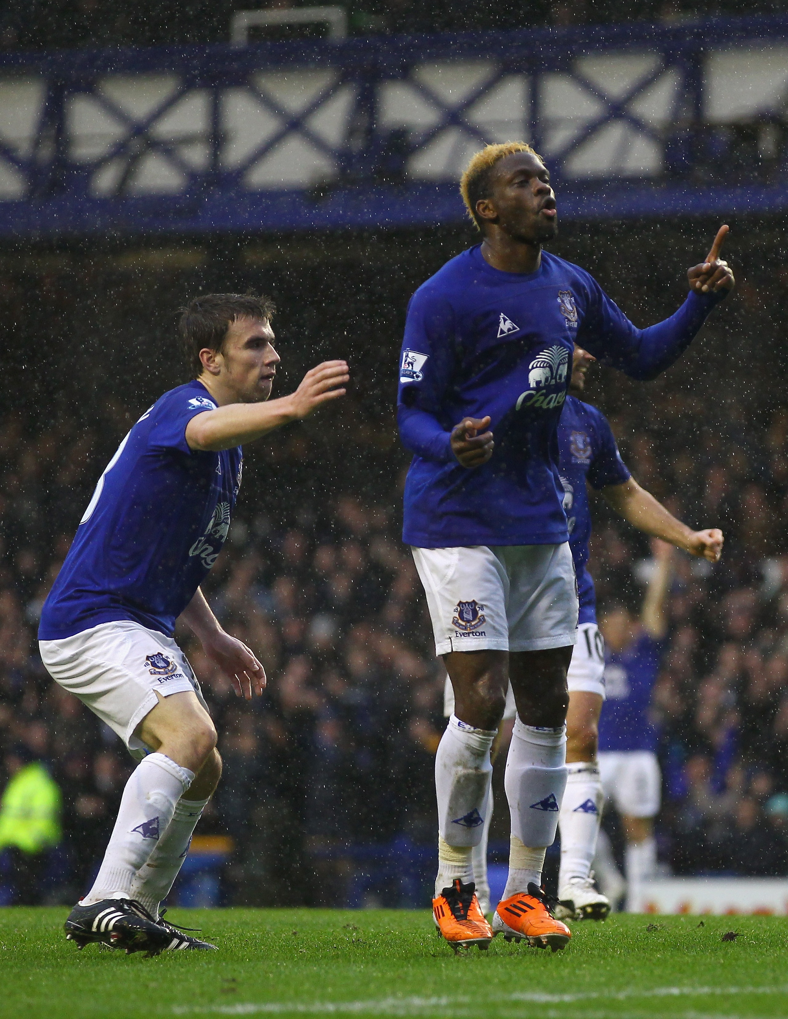 LIVERPOOL, ENGLAND - FEBRUARY 05:  Louis Saha of Everton celebrates after scoring the first goal during the Barclays Premier League match between Everton and Blackpool at Goodison Park on February 5, 2011 in Liverpool, England.  (Photo by Clive Brunskill/