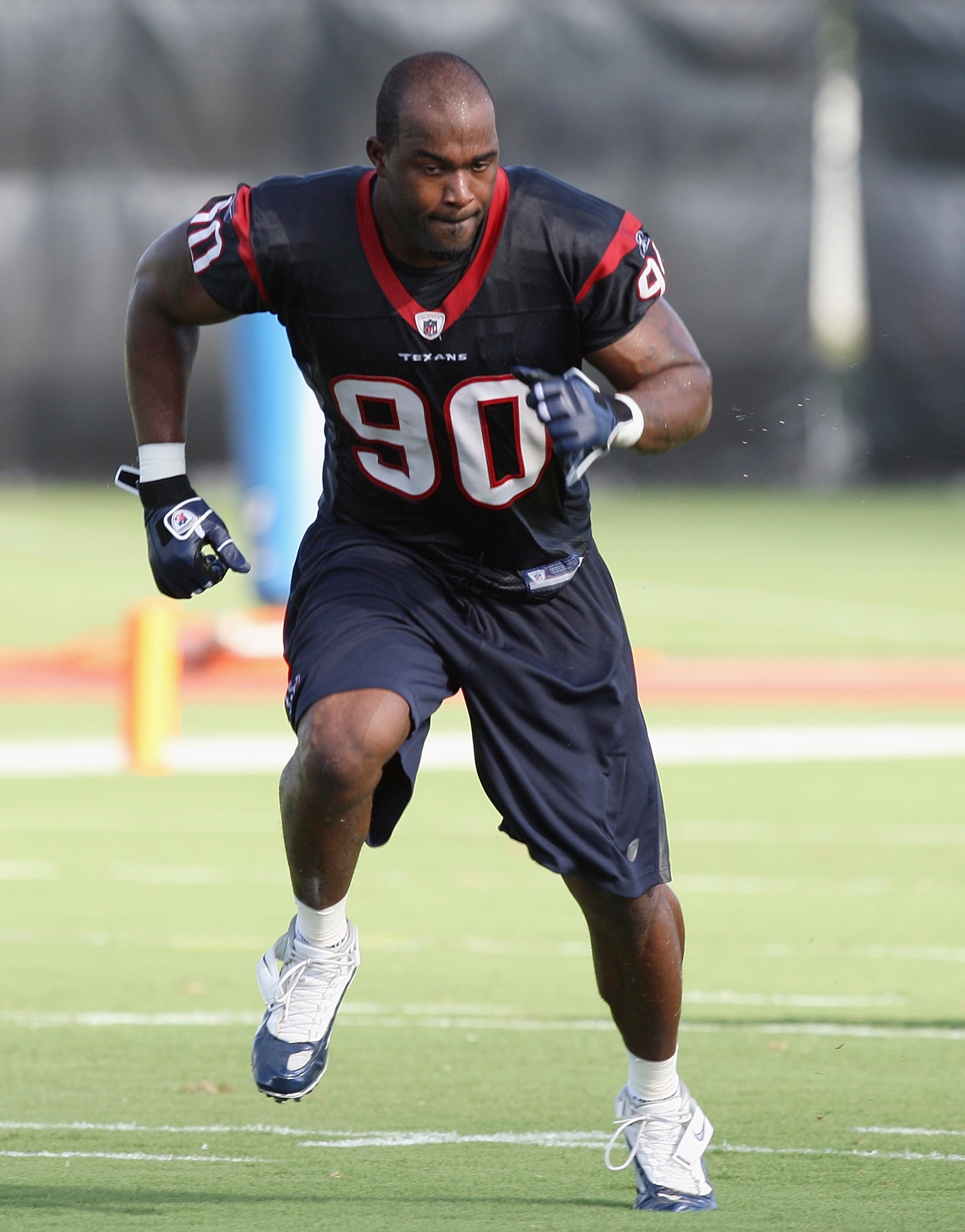 HOUSTON - JULY 30:  Defensive end Mario Williams #90 of the Houston Texans participates in the team's first NFL traiing camp practice of the season at Reliant Park on July 30, 2010 in Houston, Texas.  (Photo by Bob Levey/Getty Images)