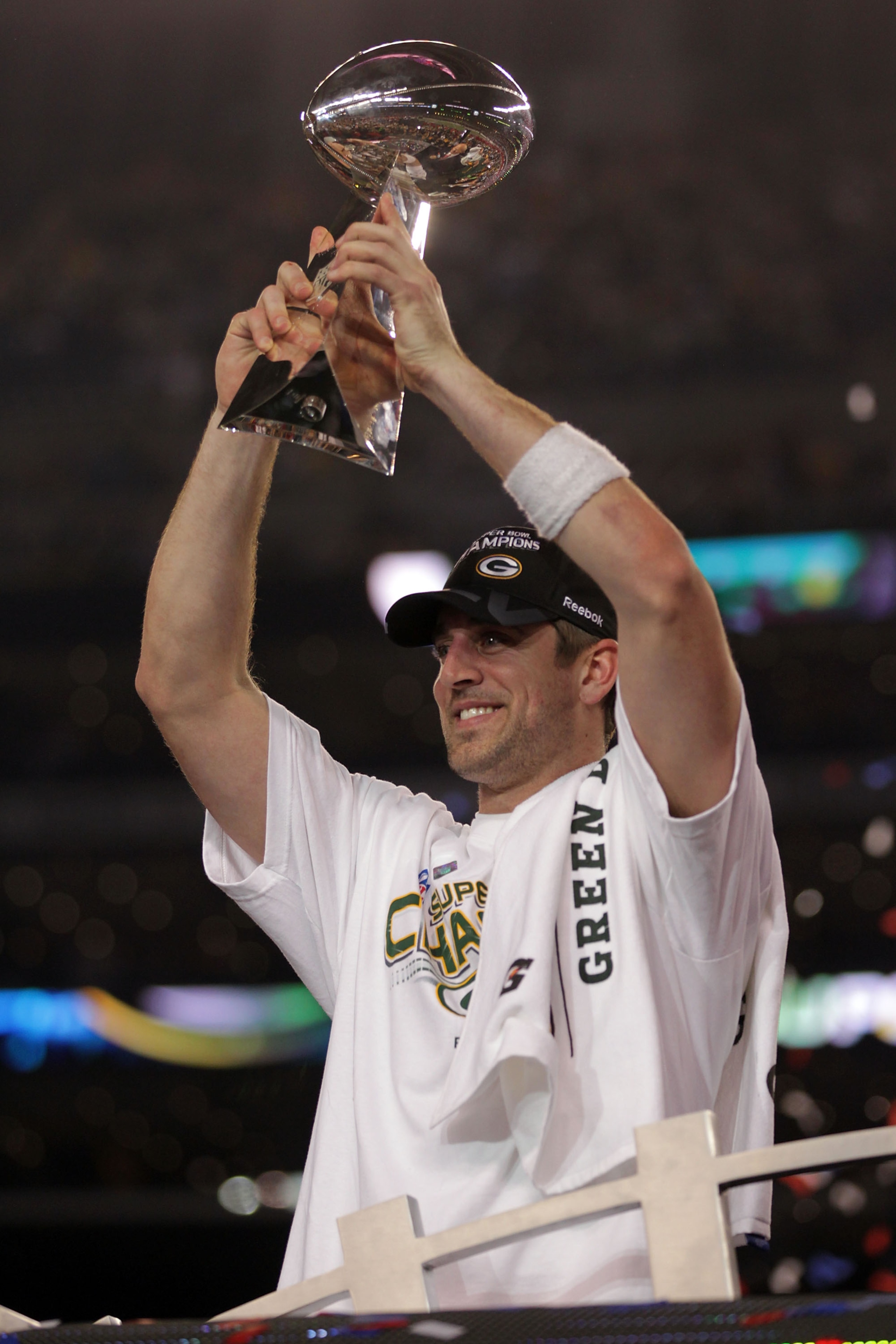 ARLINGTON, TX - FEBRUARY 06:  MVP Aaron Rodgers #12 of the Green Bay Packers holds up The Vince Lombardi Trophy after the Green Bay Packers defeated the Pittsburgh Steelers 31 to 25 in Super Bowl XLV at Cowboys Stadium on February 6, 2011 in Arlington, Te