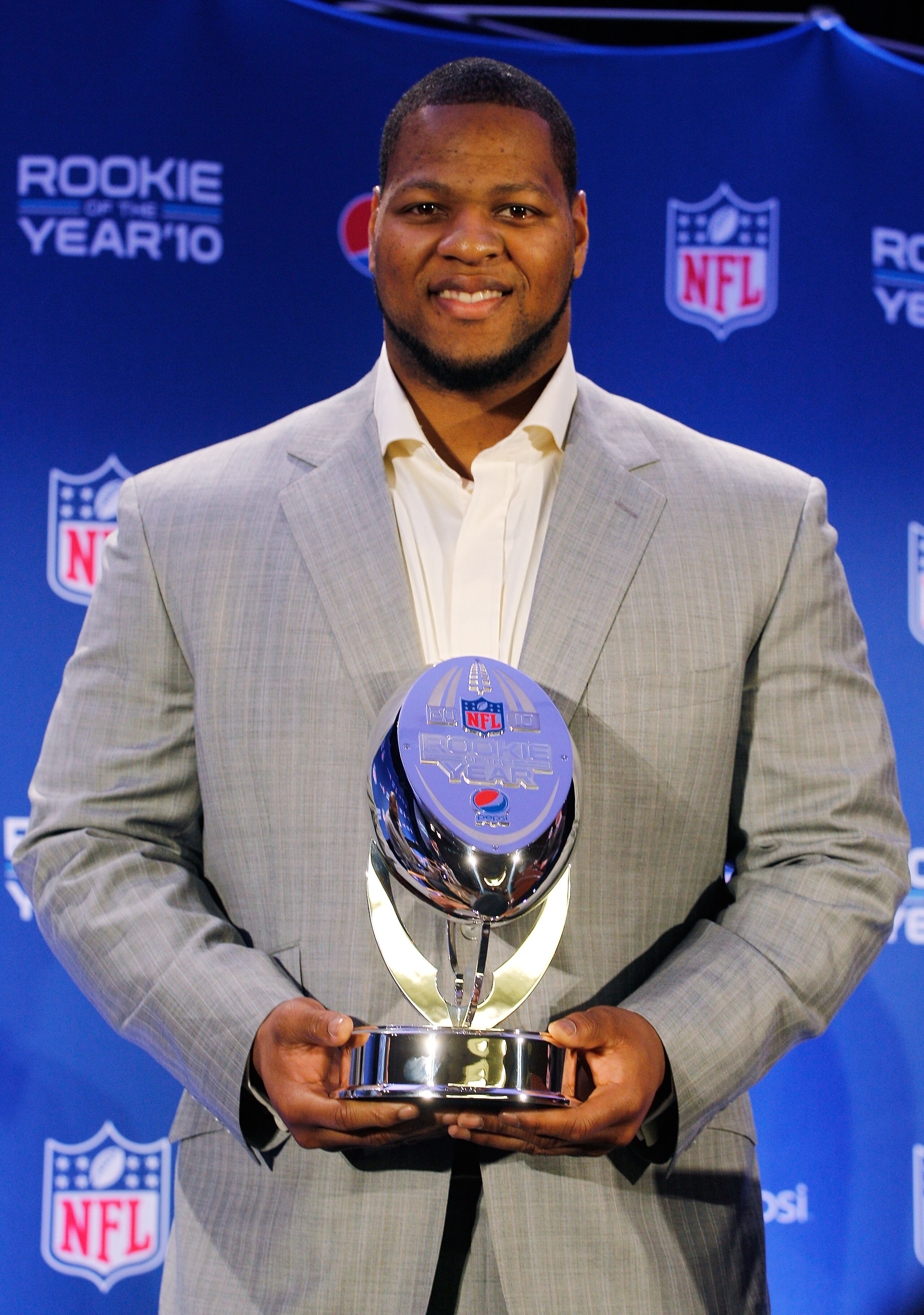 DALLAS, TX - FEBRUARY 03:  Ndamukong Suh #90 of the Detroit Lions poses during a press conference where he accepted Pepsi's 2010 NFL Rookie of the Year Award at the Super Bowl XLV media center on February 3, 2011 in Dallas, Texas. The Green Bay Packers wi