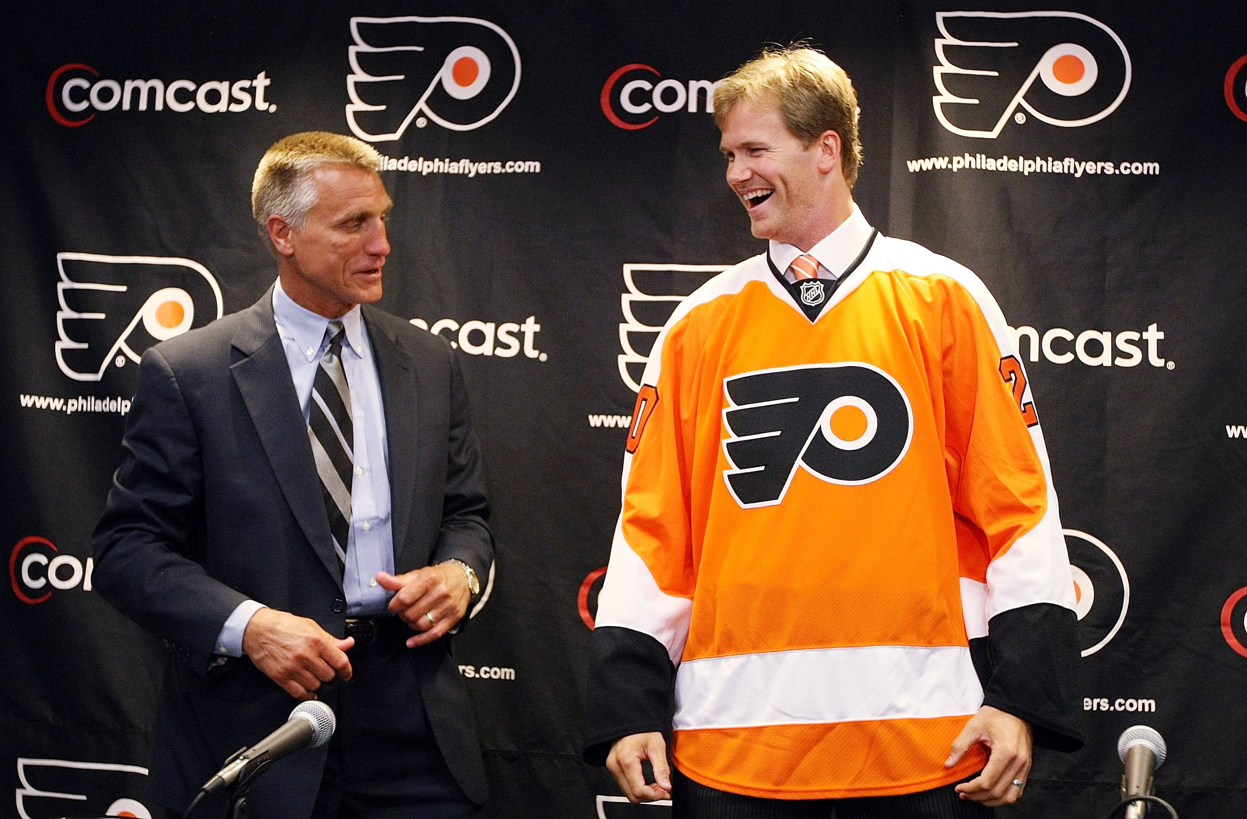 PHILADELPHIA - JULY 06: Flyers General Manager, Paul Holmgren (L) presents Chris Pronger #20 of the Philadelphia Flyers with his new jersey during his first press conference as a Philadelphia Flyer at Flyer's Skate Zone on July 6, 2009 in Philadelphia, P PHILADELPHIA - JULY 06: Flyers General Manager, Paul Holmgren (L) presents Chris Pronger #20 of the Philadelphia Flyers with his new jersey during his first press conference as a Philadelphia Flyer at Flyer's Skate Zone on July 6, 2009 in Philadelphia, P