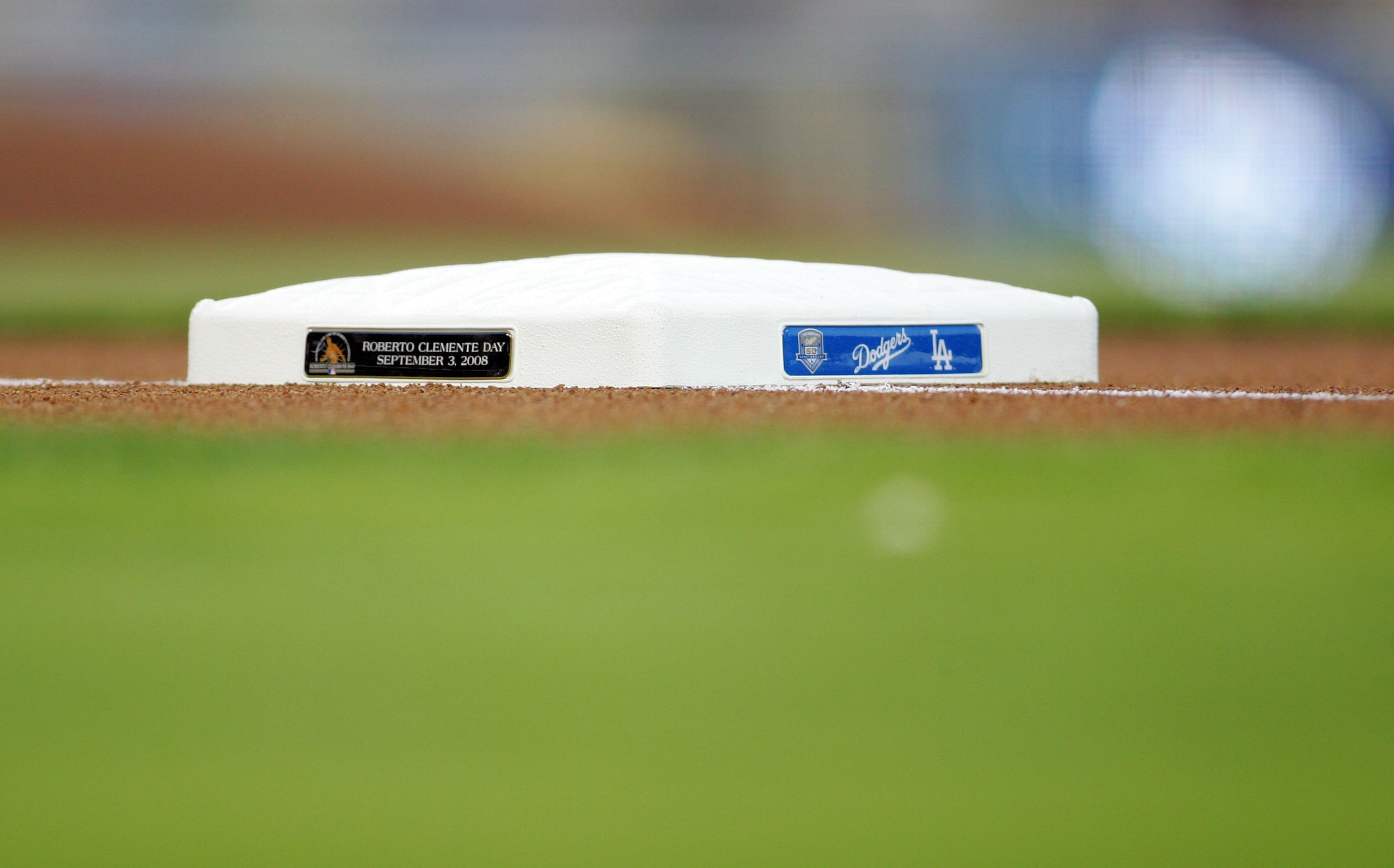 LOS ANGELES, CA - SEPTEMBER 03:  A detailed view of the first base bag with a sign tab commemorating 'Roberto Clemente Day' prior to the MLB game between the San Diego Padres and the Los Angeles Dodgers at Dodger Stadium on September 3, 2008 in Los Angele
