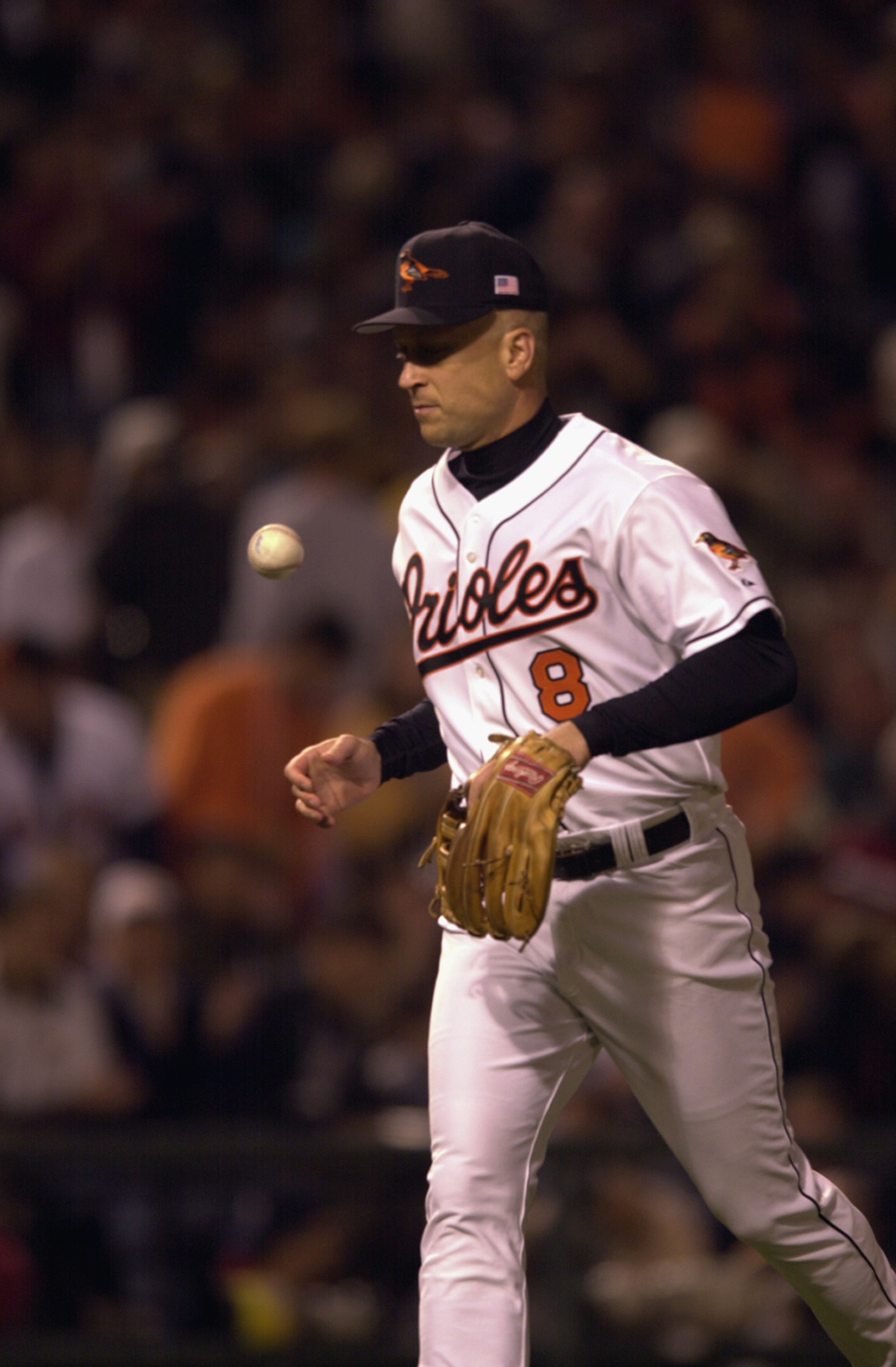 BALTIMORE - OCTOBER 6:  On the 3001st and final game of his career, Cal Ripken Jr. #8 of the Baltimore Orioles retires to the dugout so the Boston Red Sox can take the field at Camden Yards in Baltimore, Maryland. The Red Sox won, 2-0.  (Photo by: Doug Pe