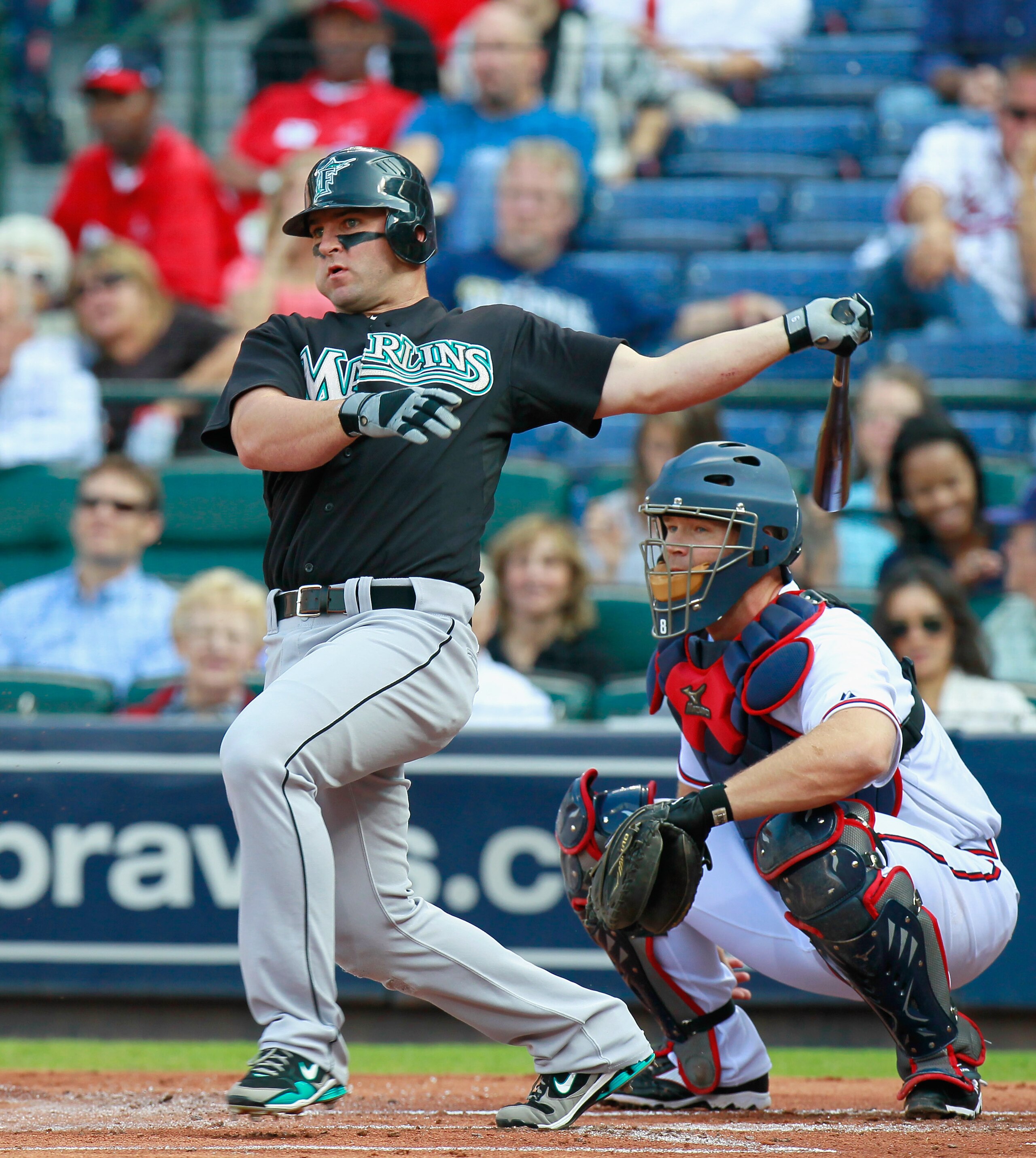 ATLANTA - SEPTEMBER 29:  Dan Uggla #6 of the Florida Marlins against David Ross #8 of the Atlanta Braves at Turner Field on September 29, 2010 in Atlanta, Georgia.  (Photo by Kevin C. Cox/Getty Images)